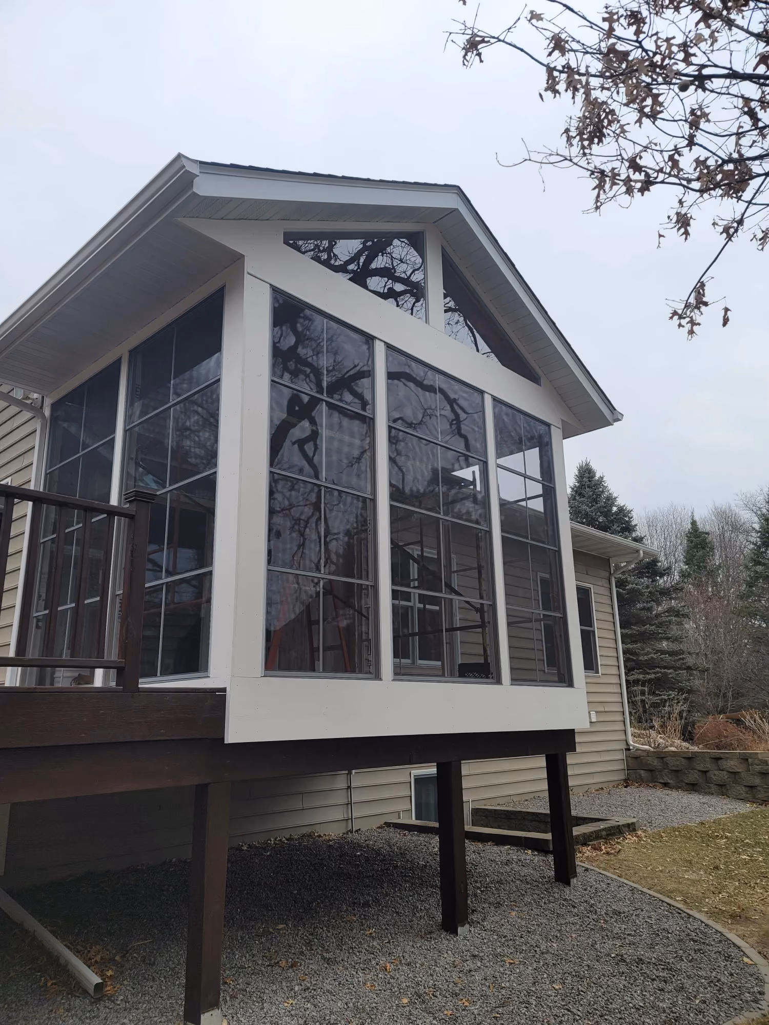 Exterior view of a small cabin with large windows