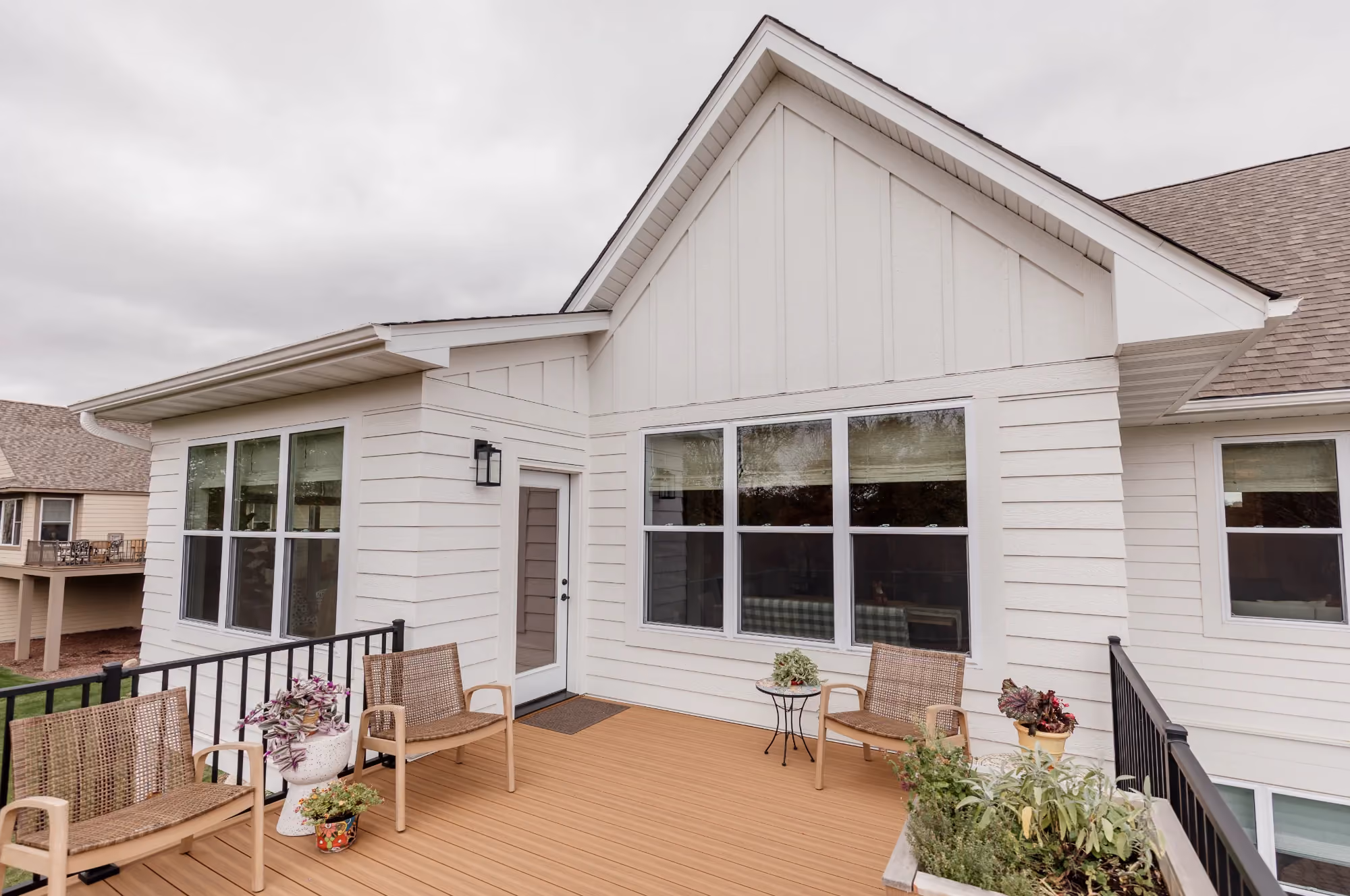 White house exterior with wraparound deck seating