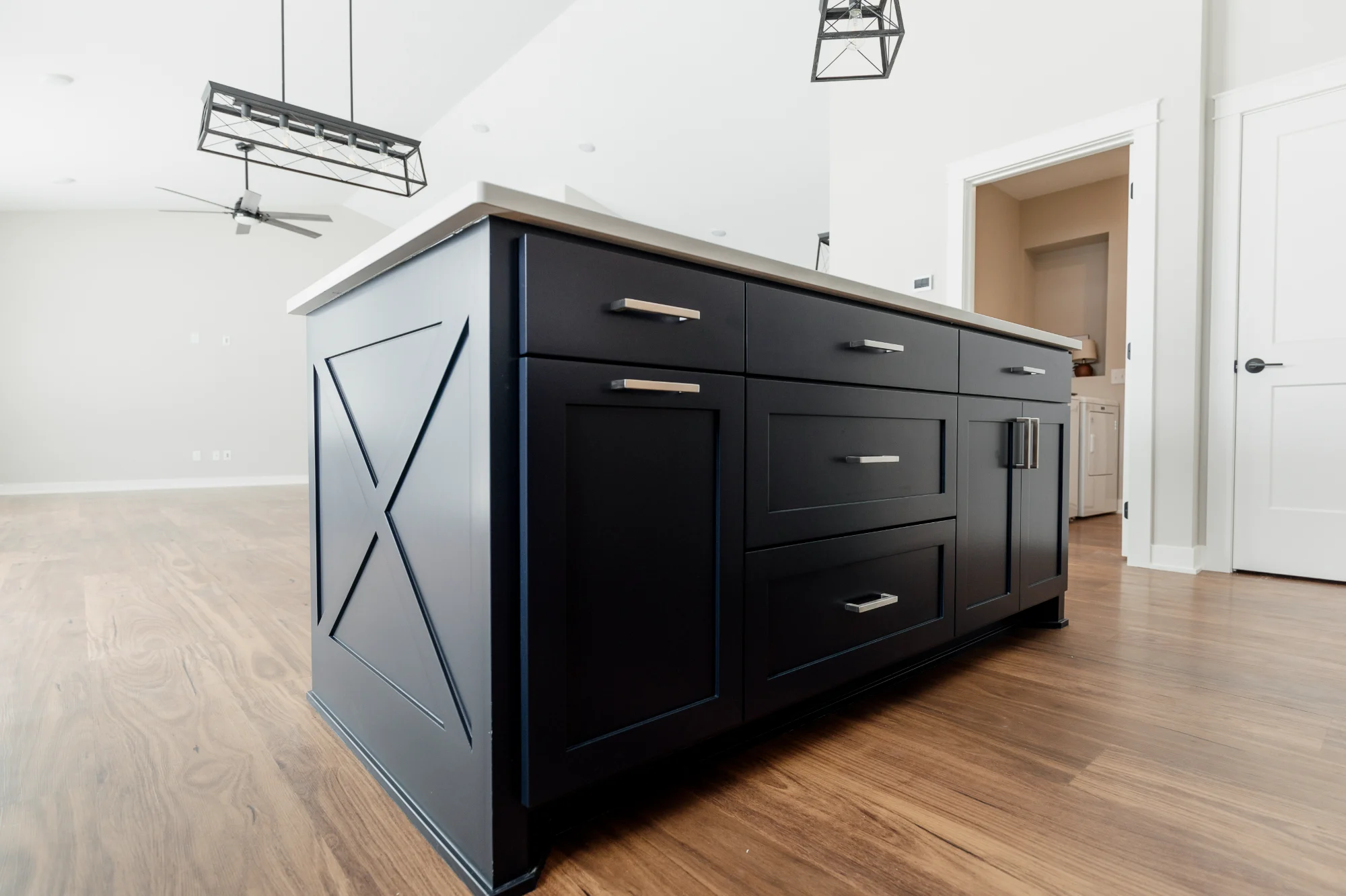 Dark blue kitchen island with farmhouse sink