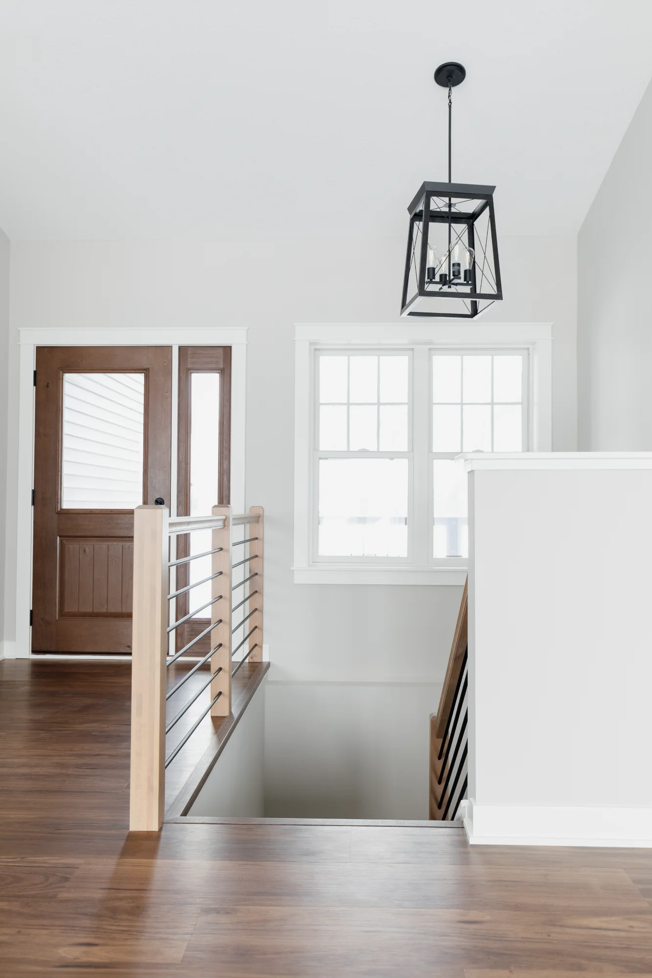 Hallway with pendant light and leaning mirror