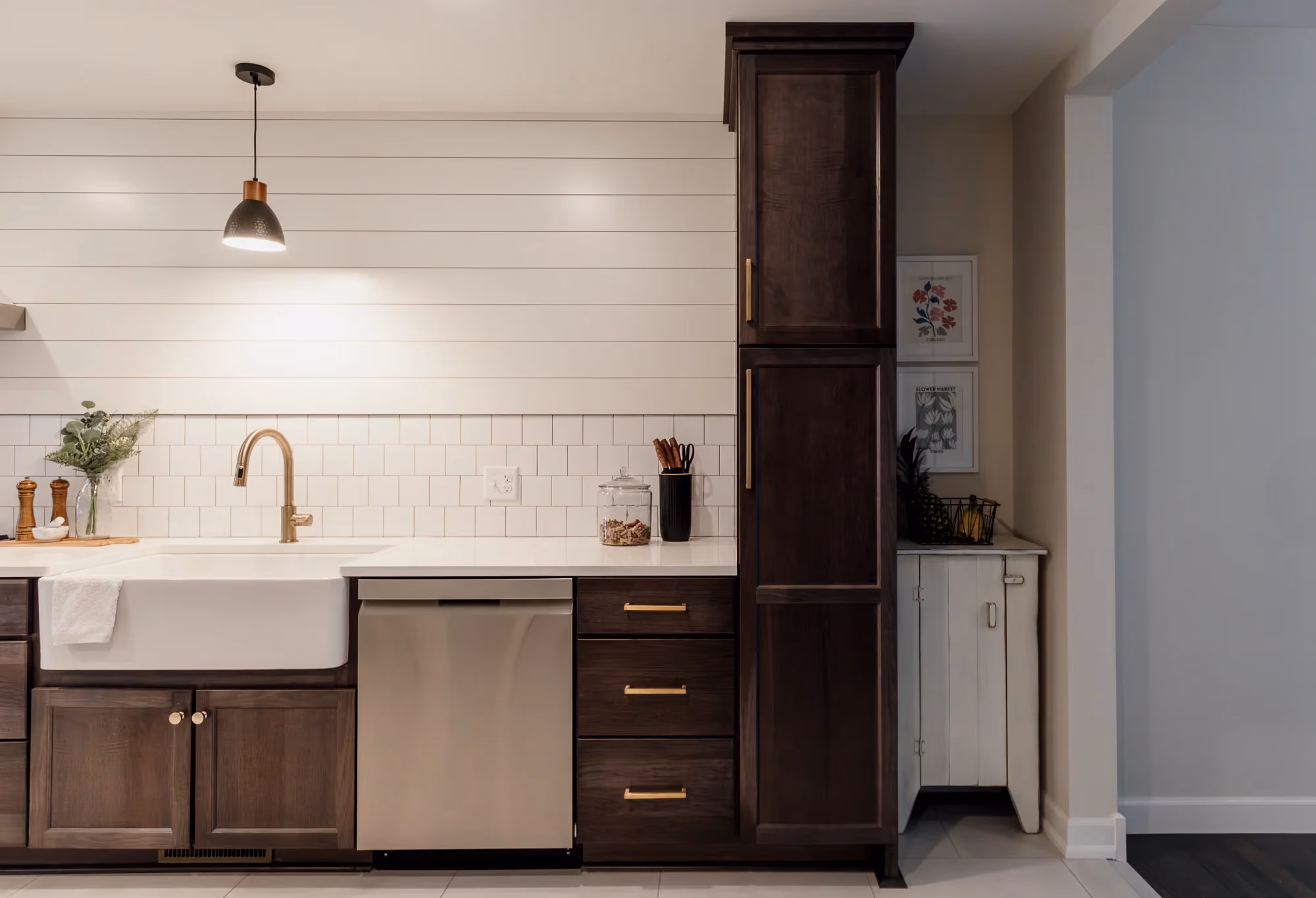 Modern kitchen with white tile backsplash and dark cabinets