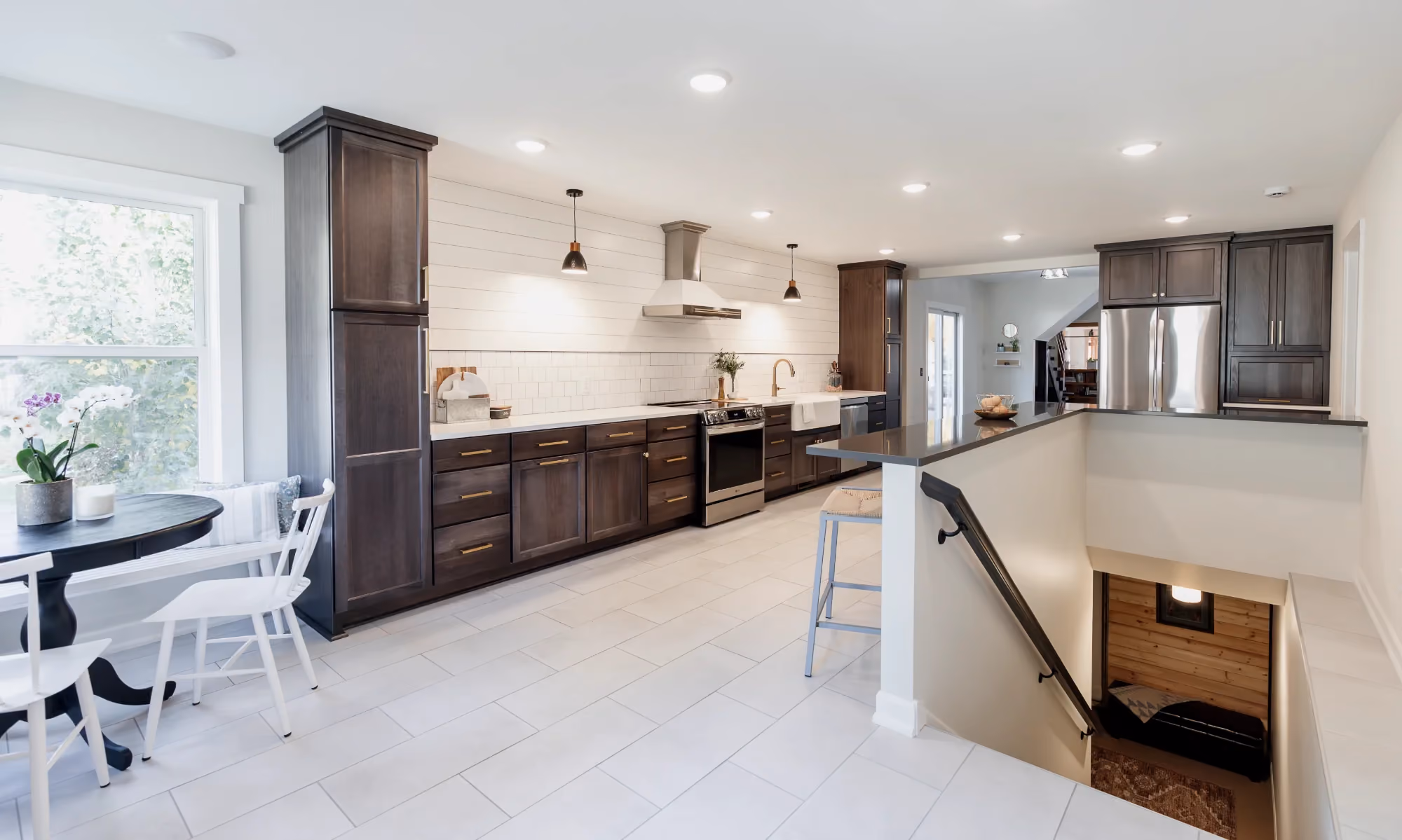 Bright open kitchen with long island and dark cabinets