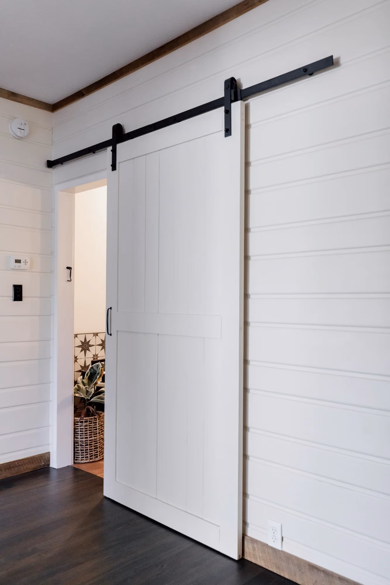 Sliding barn door in a home hallway