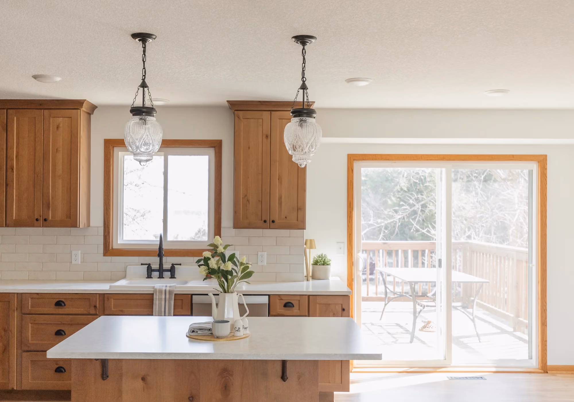 Kitchen island by window and sliding glass door