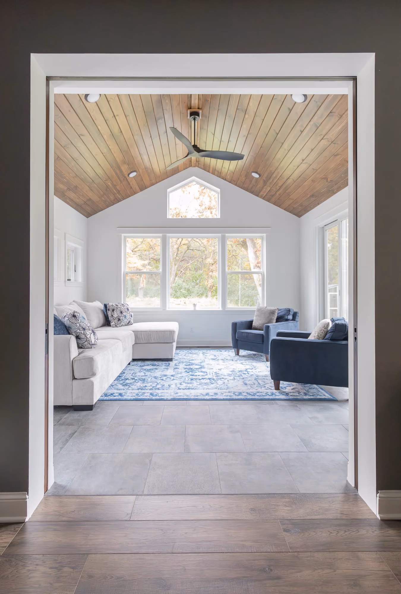 Bright entry hallway with front door and staircase