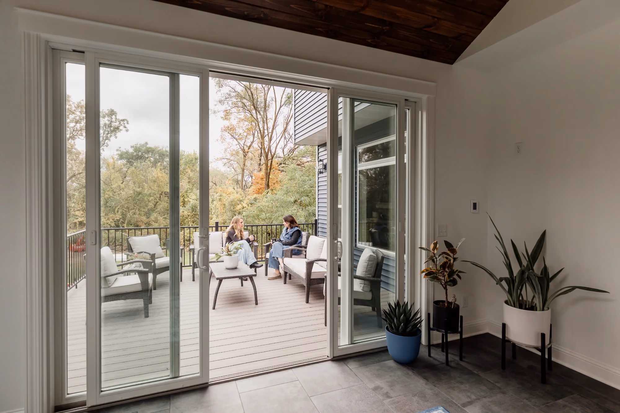 Living room with floor-to-ceiling sliding glass doors