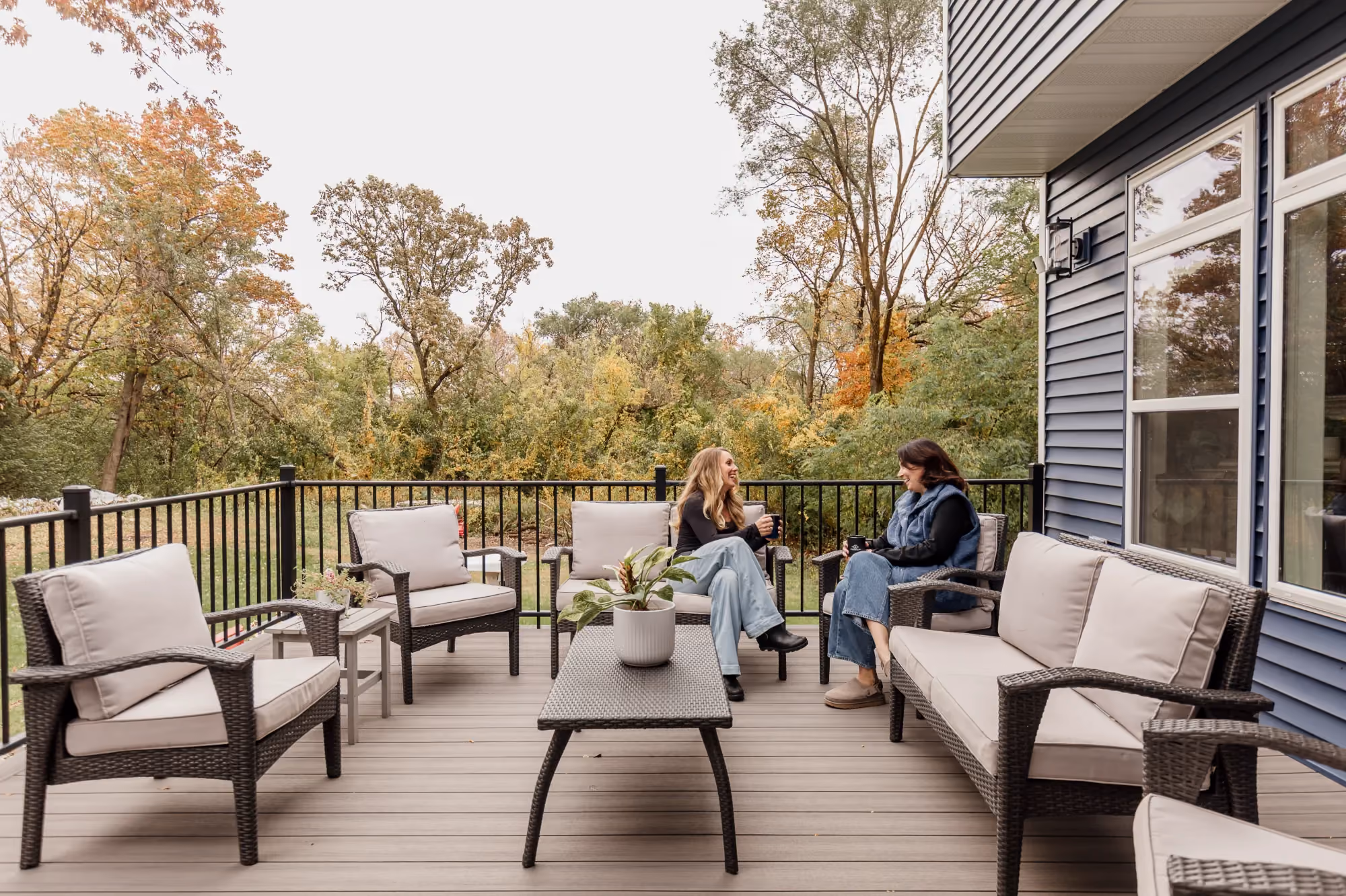 Outdoor deck with conversation seating and umbrella