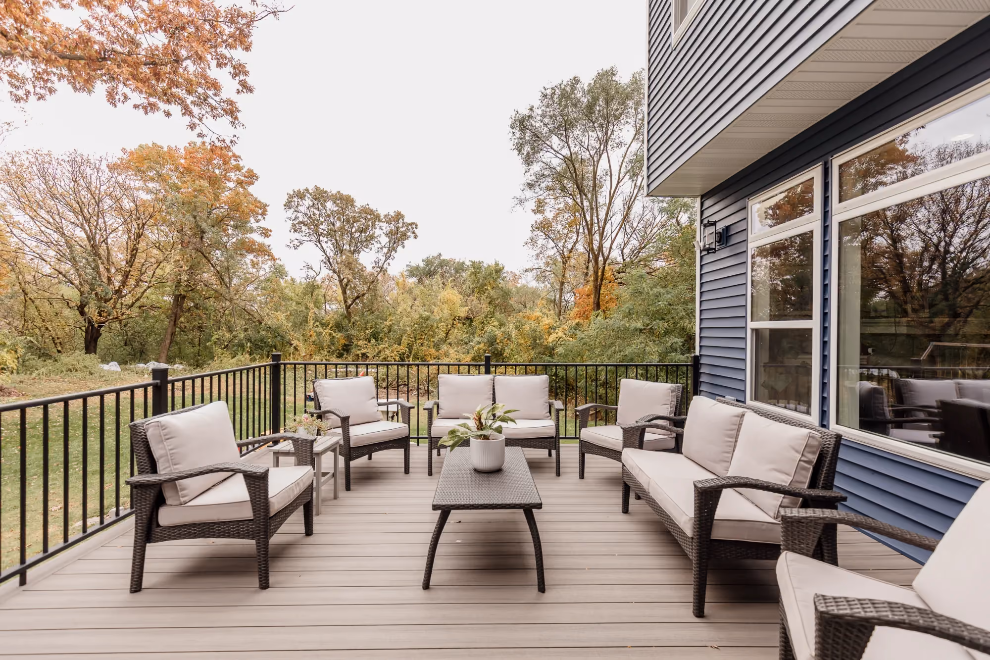 Outdoor patio with lounge chairs and dining table on deck