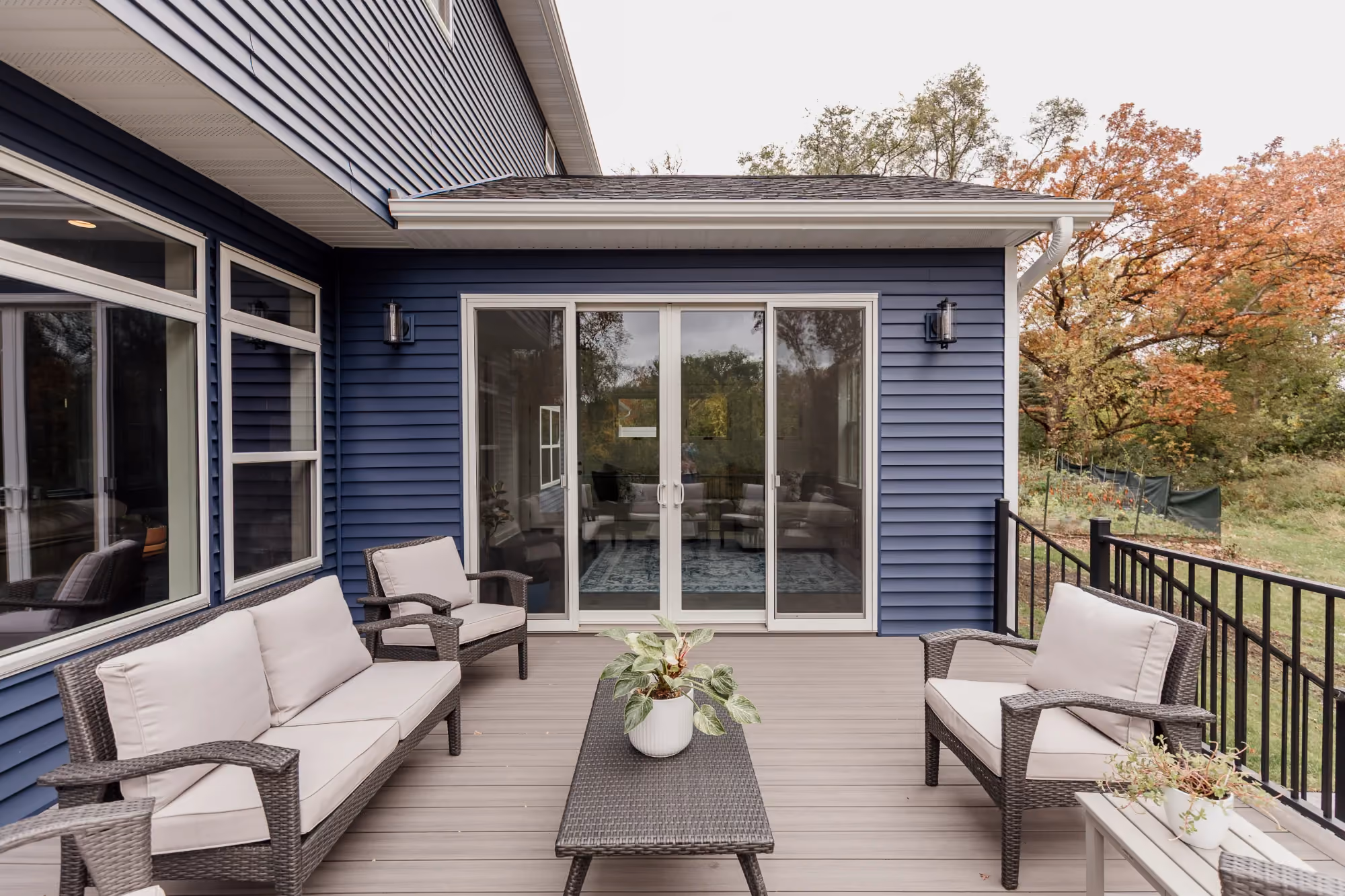 Outdoor deck patio with seating and sliding doors