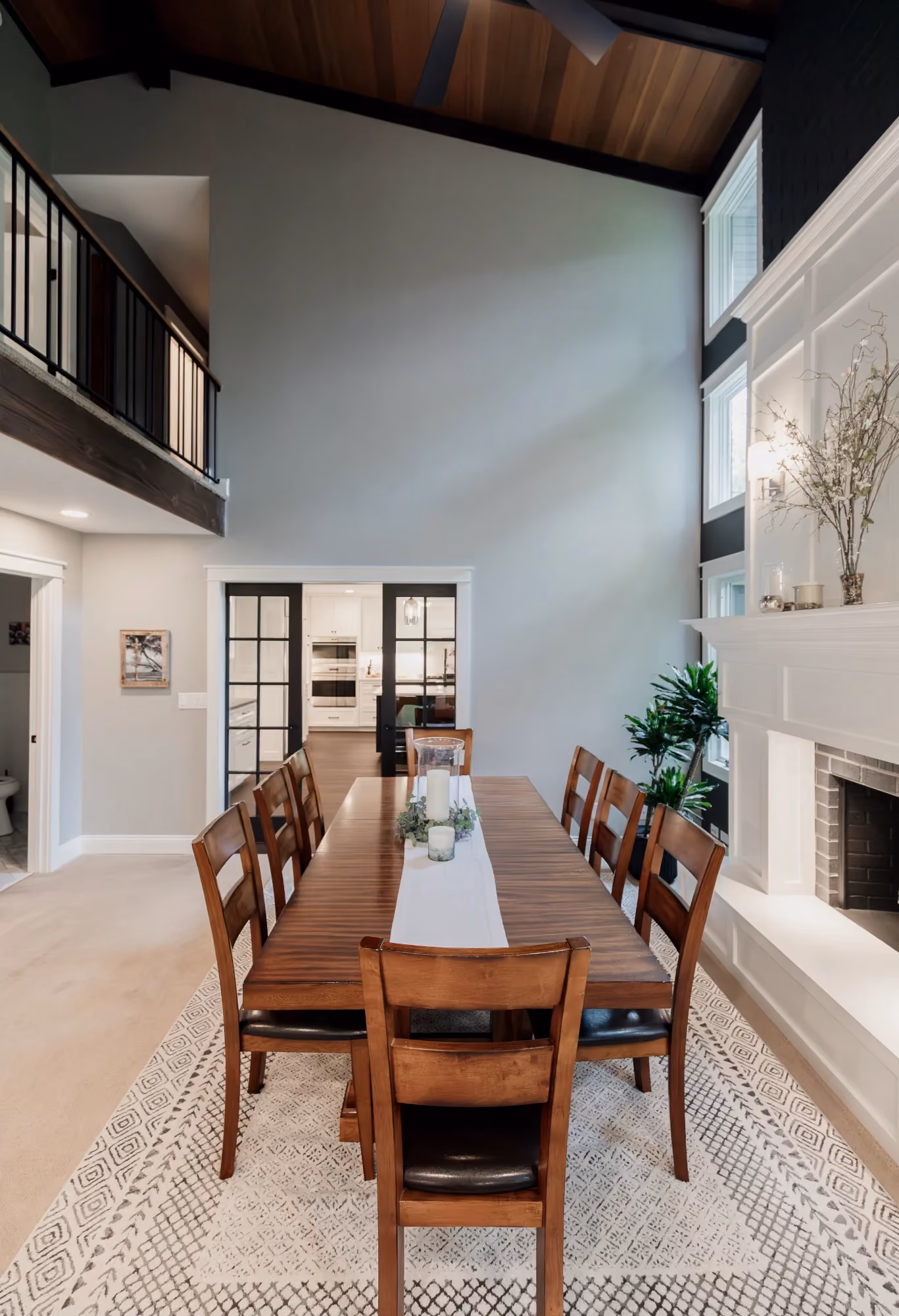 Dining room with long table and exposed beam ceiling