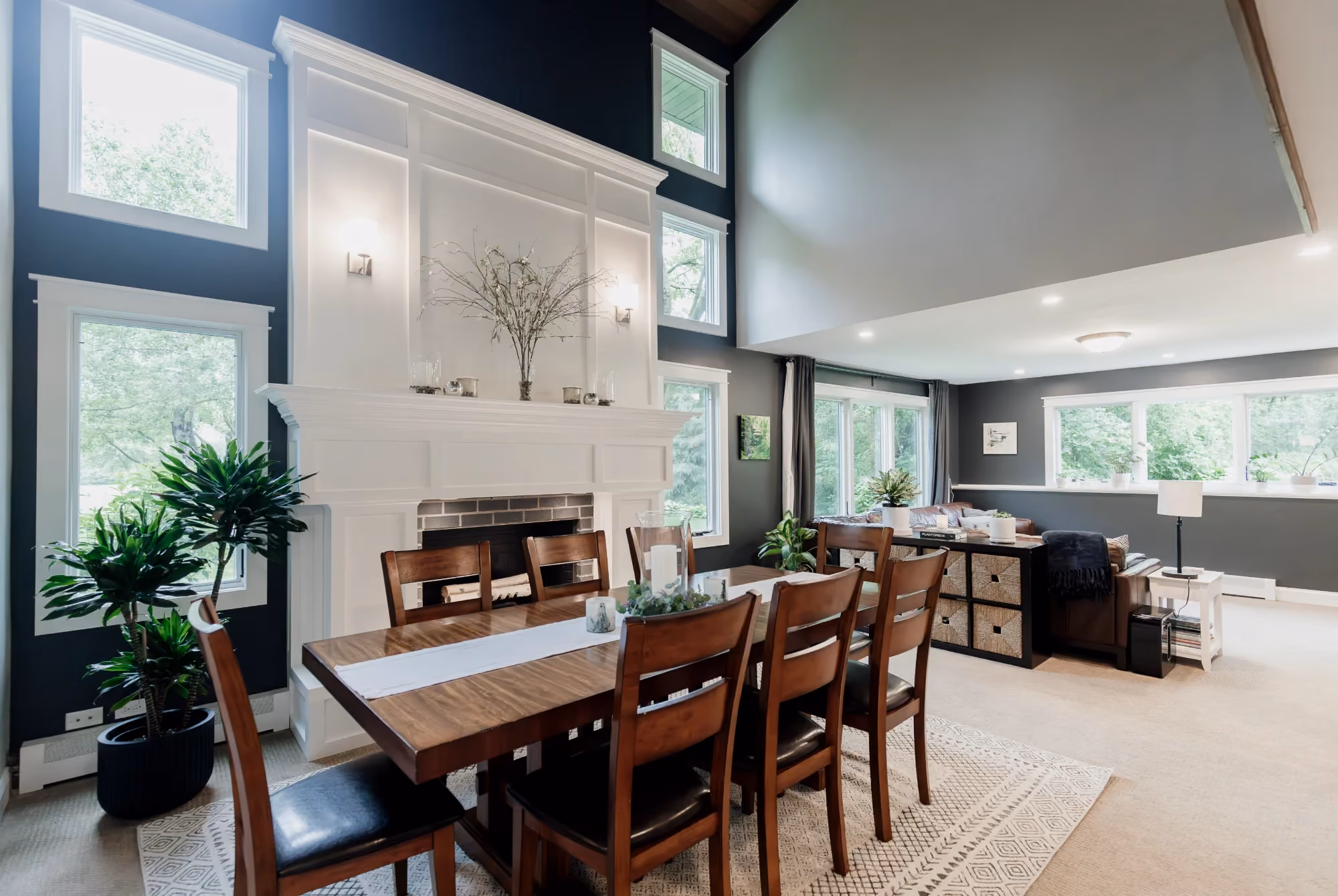Open dining area with wood table and living room view