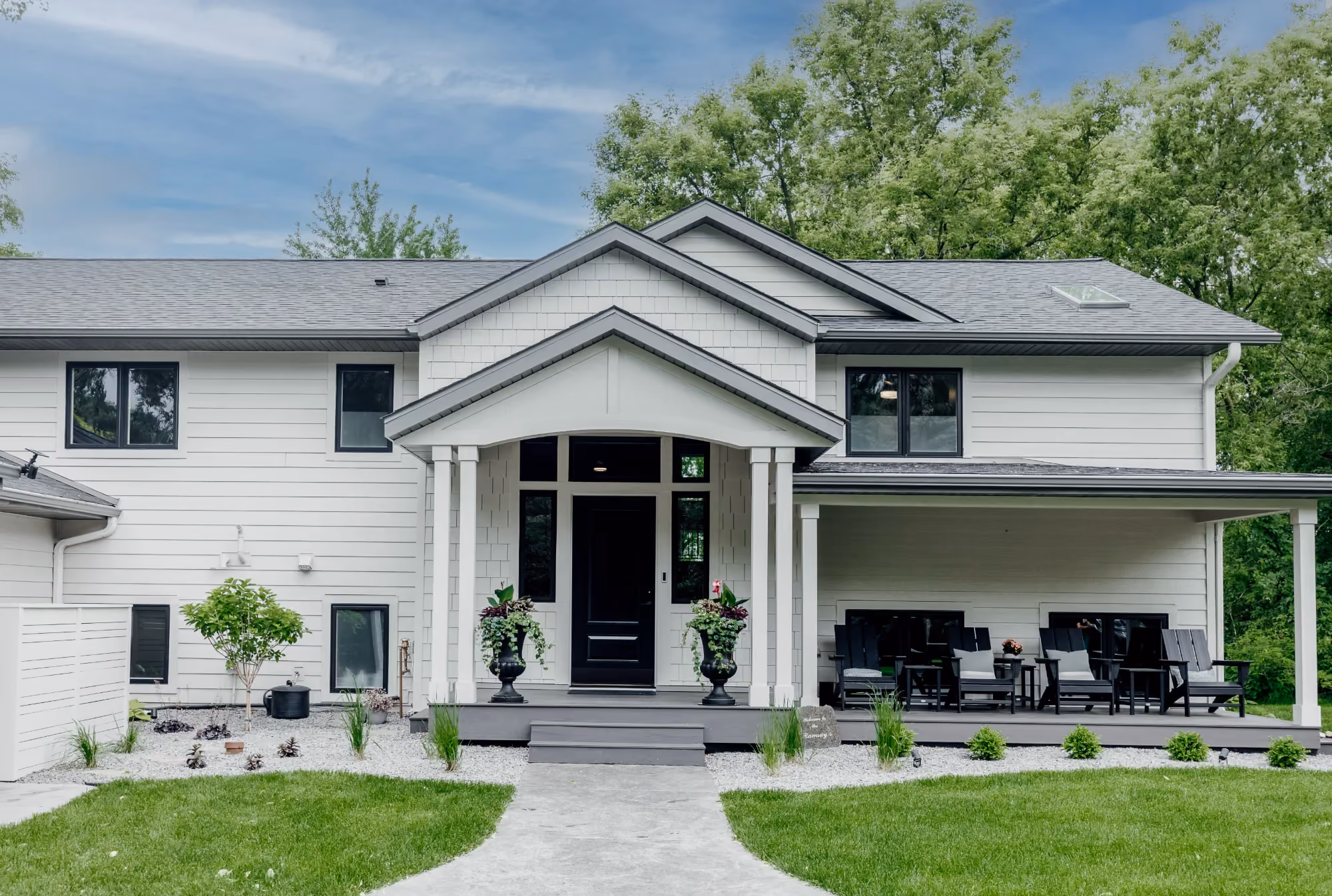 Front view of modern white house with covered porch
