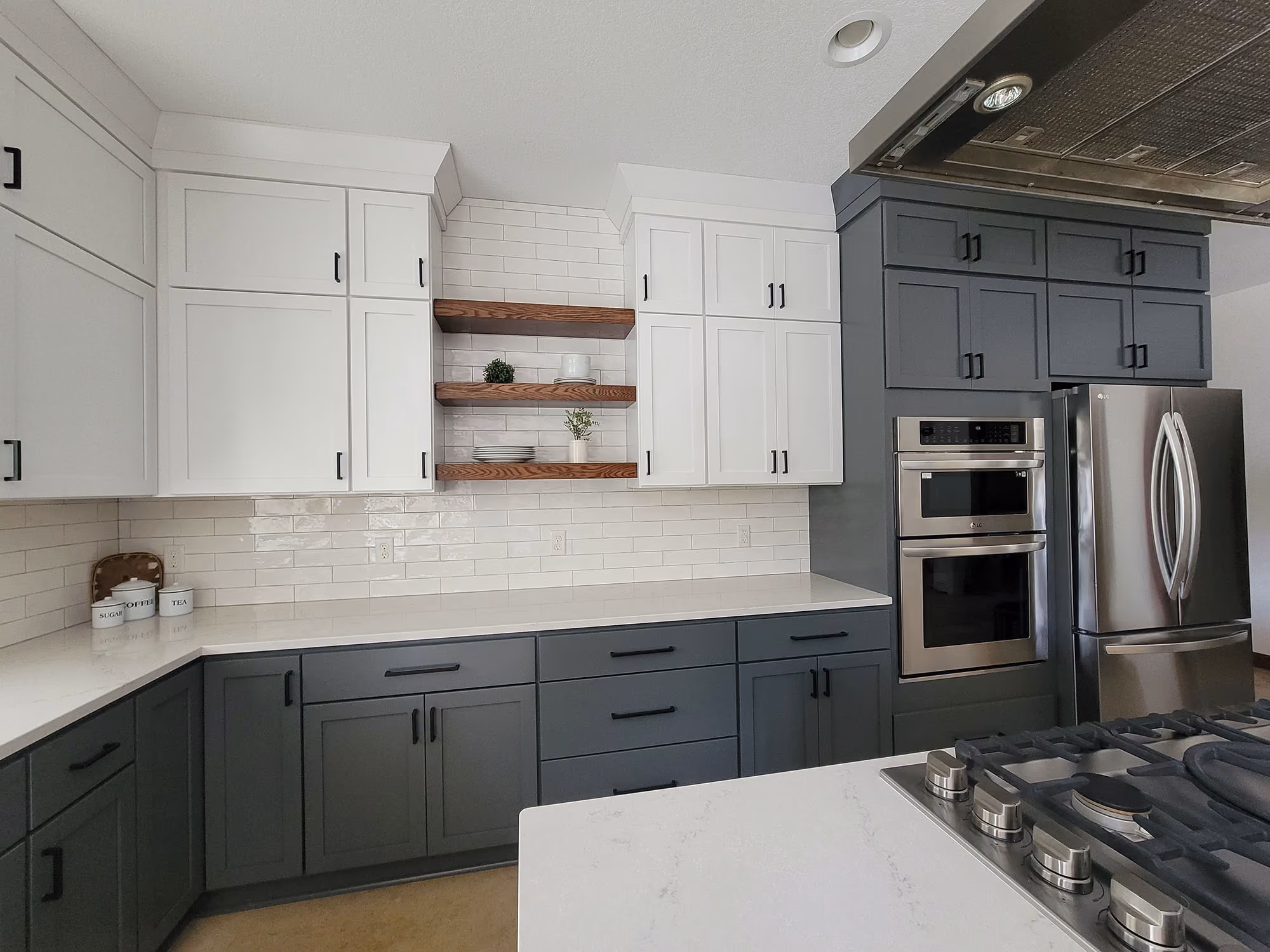 Gray-and-white kitchen with island and range hood
