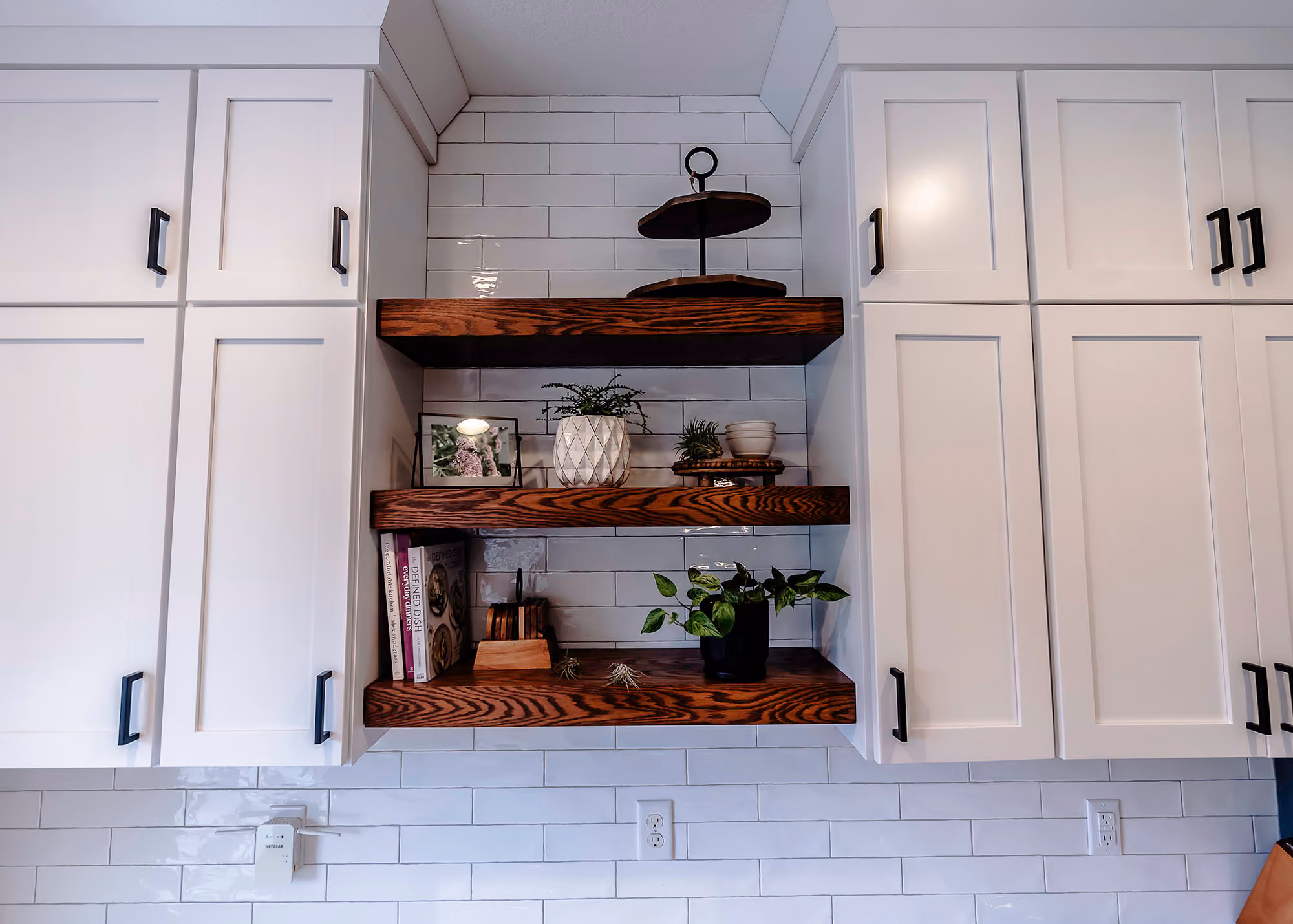 Open wood shelves in white kitchen nook