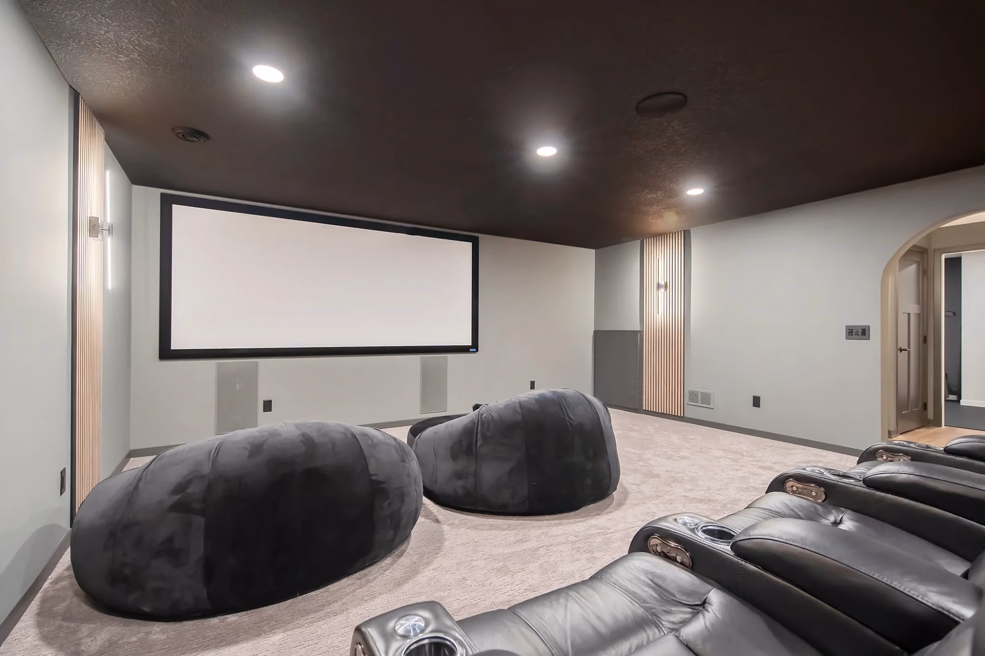 Basement lounge with sectional sofa and bar