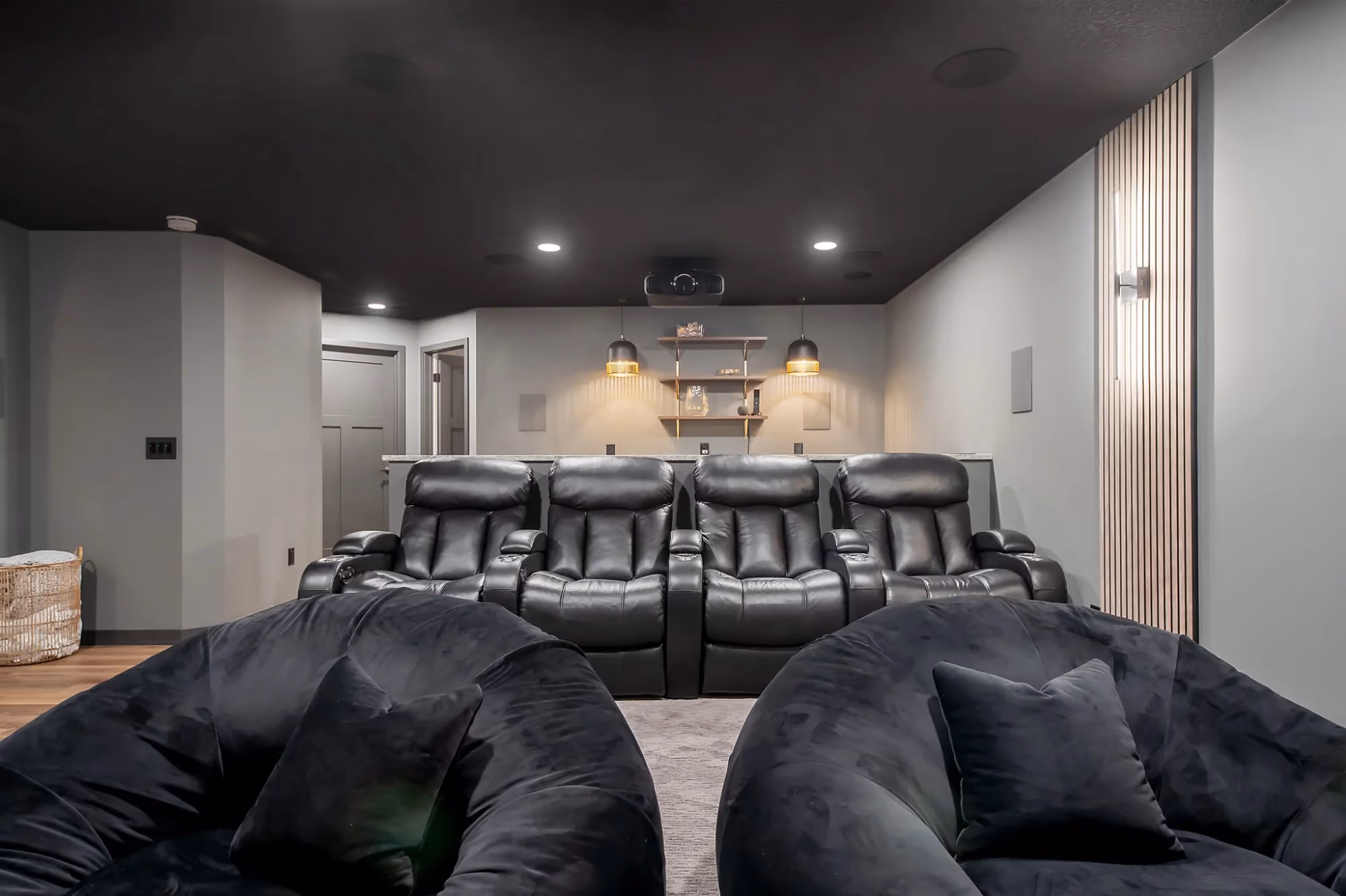 Basement lounge with sectional sofa and bar