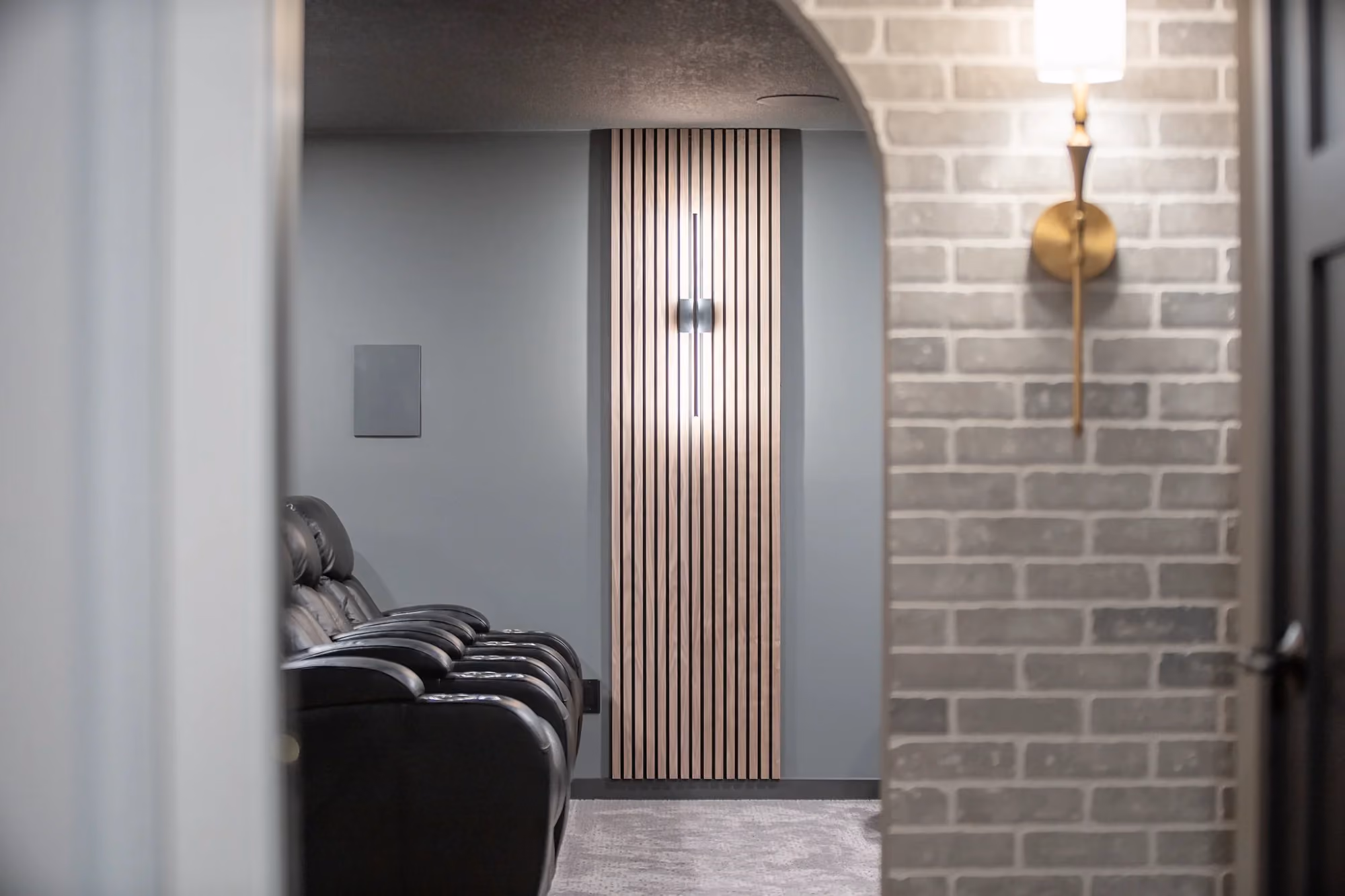 Home elevator beside brick wall