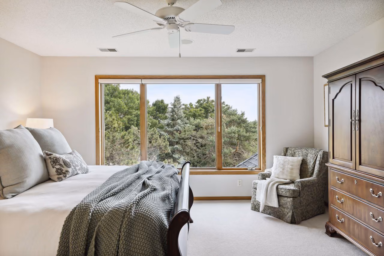 Bedroom with sliding glass doors to backyard