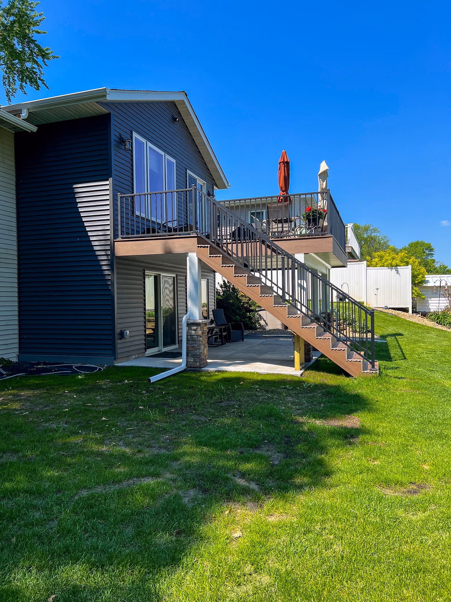 Side view of house with deck and stairs
