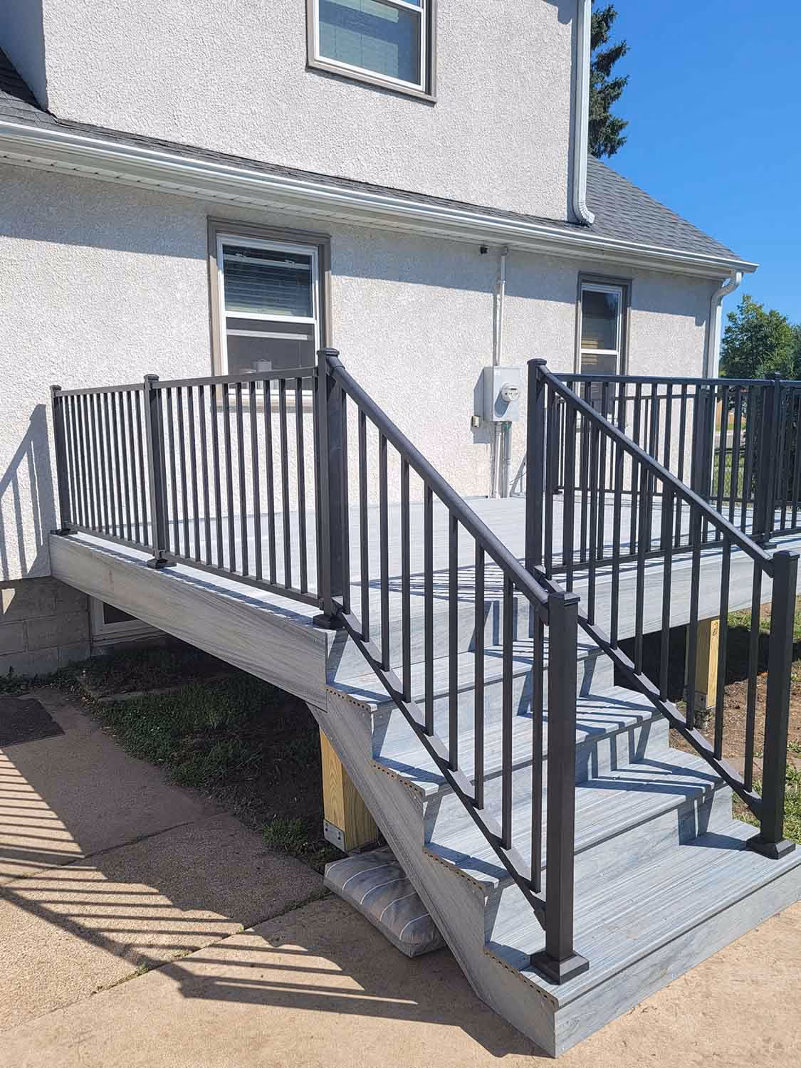 Small side steps with black metal railings