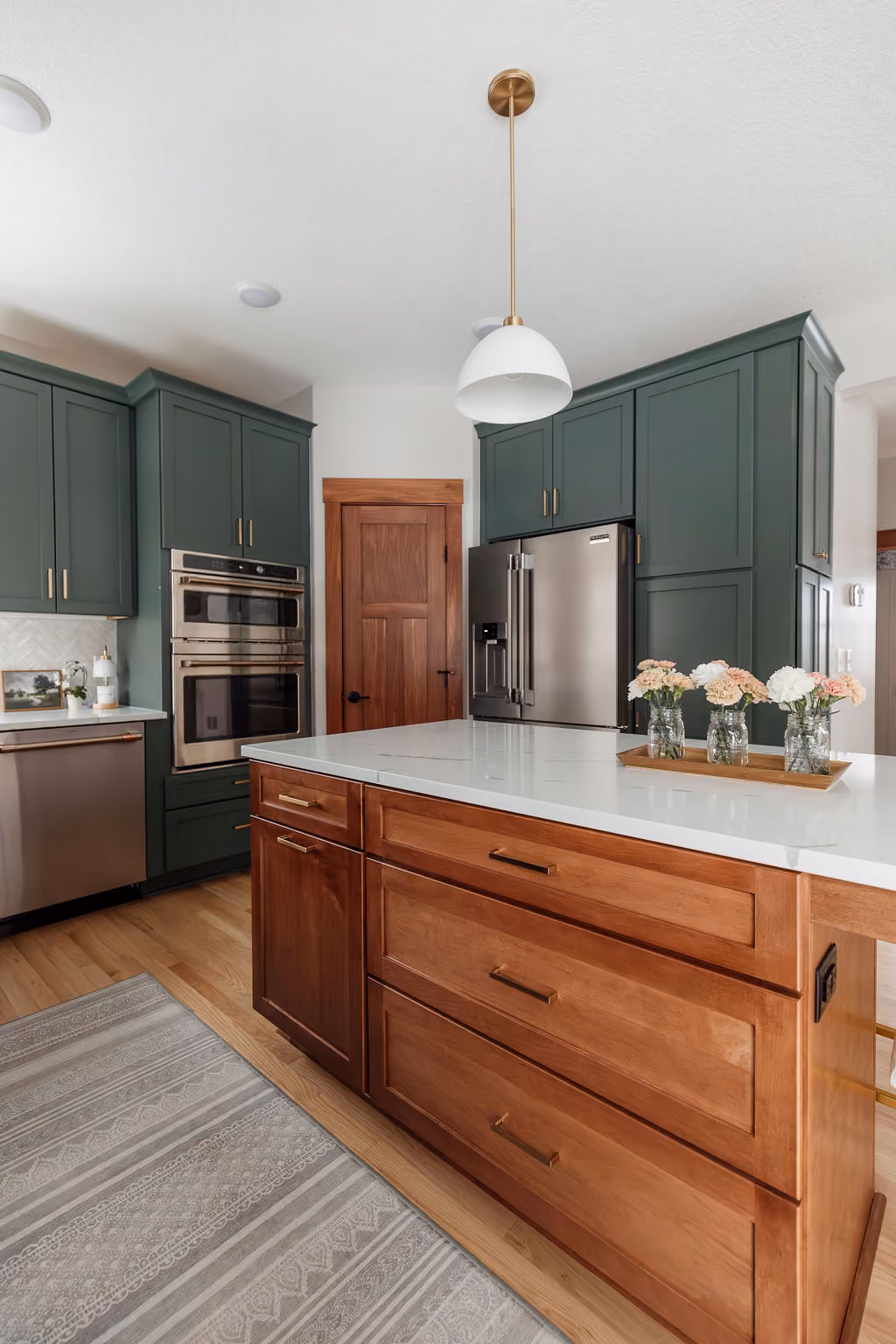 Bright custom kitchen featuring wood cabinetry