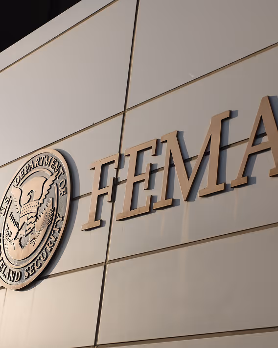 Exterior wall with the U.S. Department of Homeland Security seal and large FEMA letters mounted.