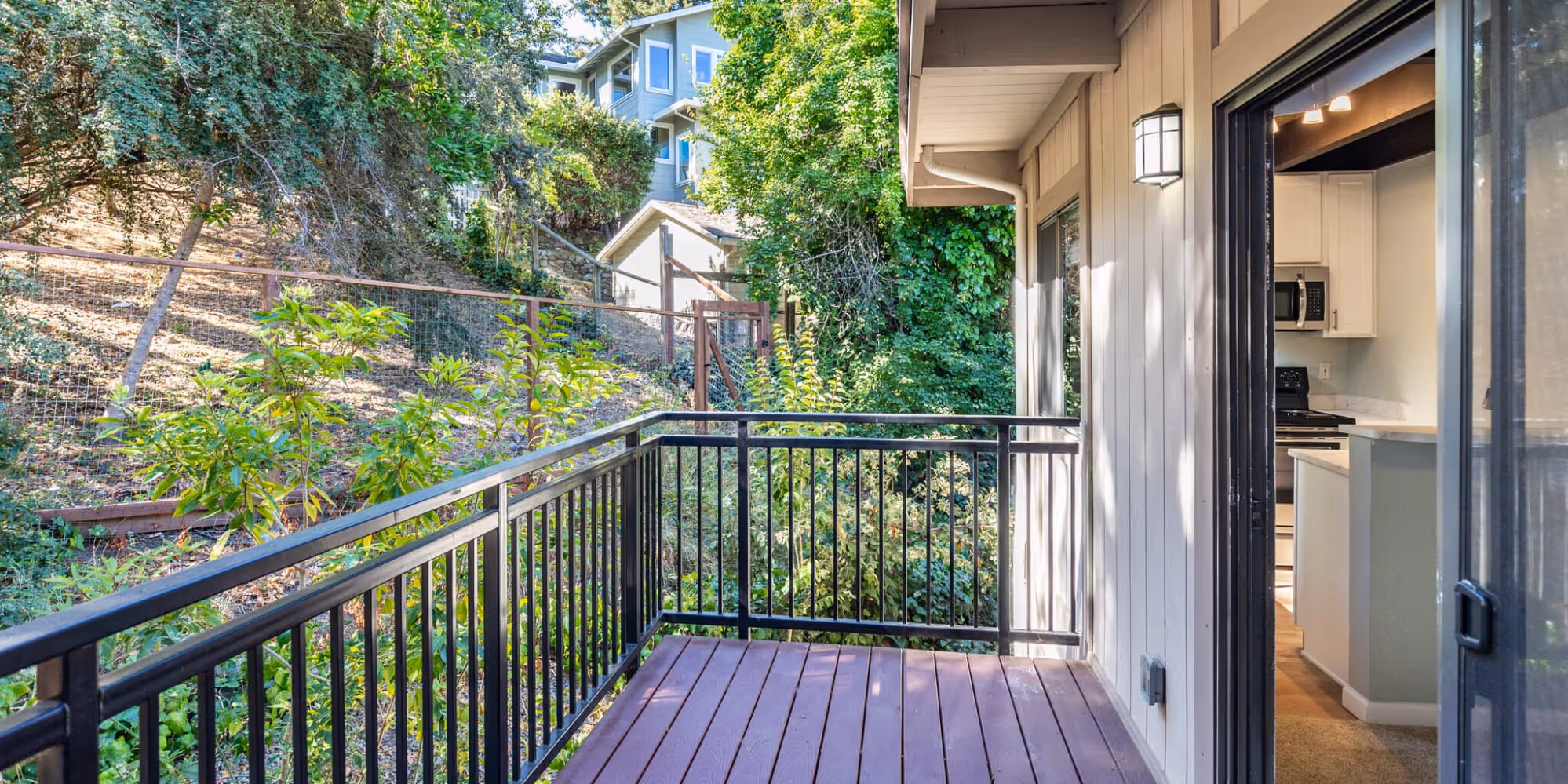 South Knoll exterior of balcony surrounded by trees