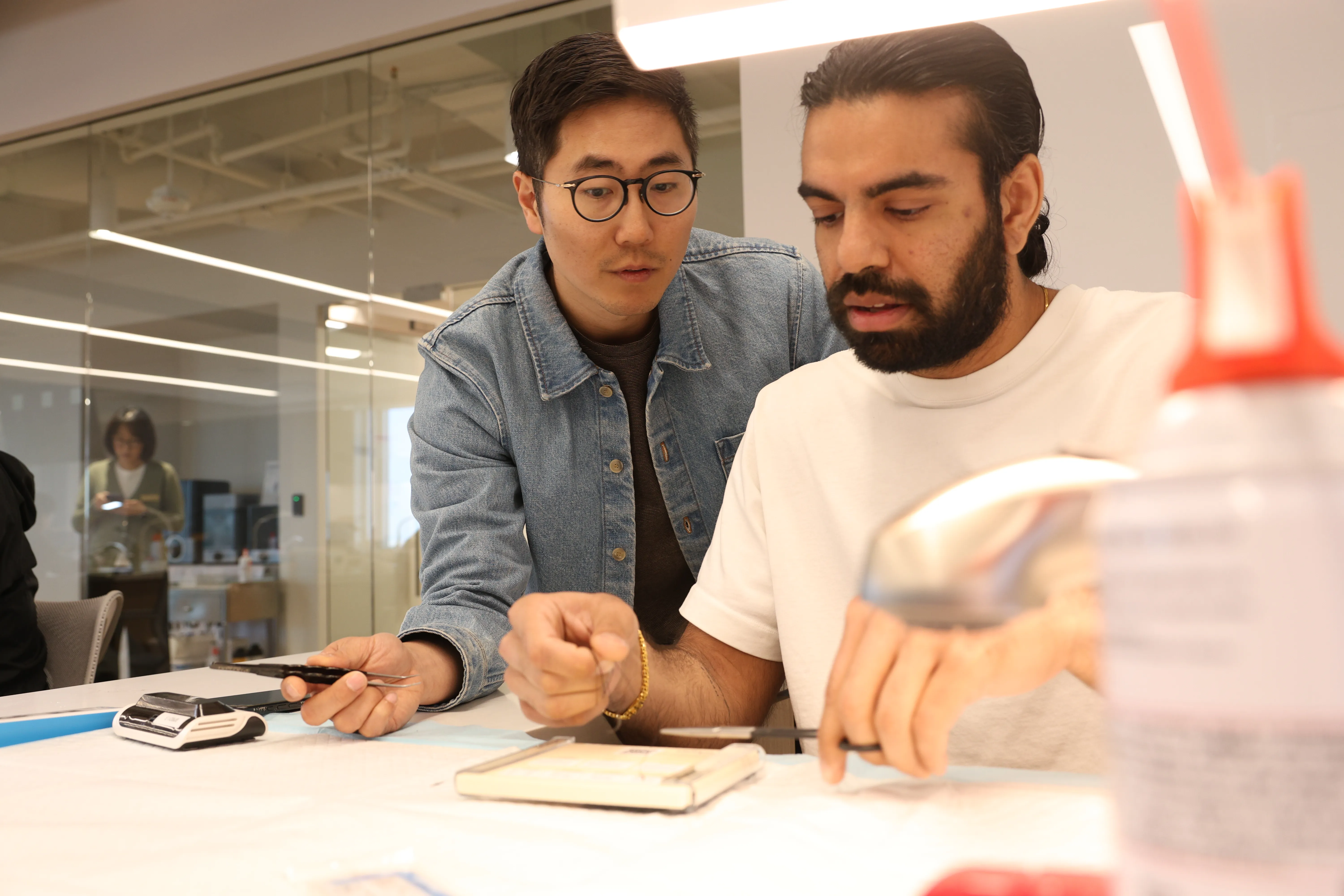 Dental professionals attending a hands-on course led by Dr. Chris Kim