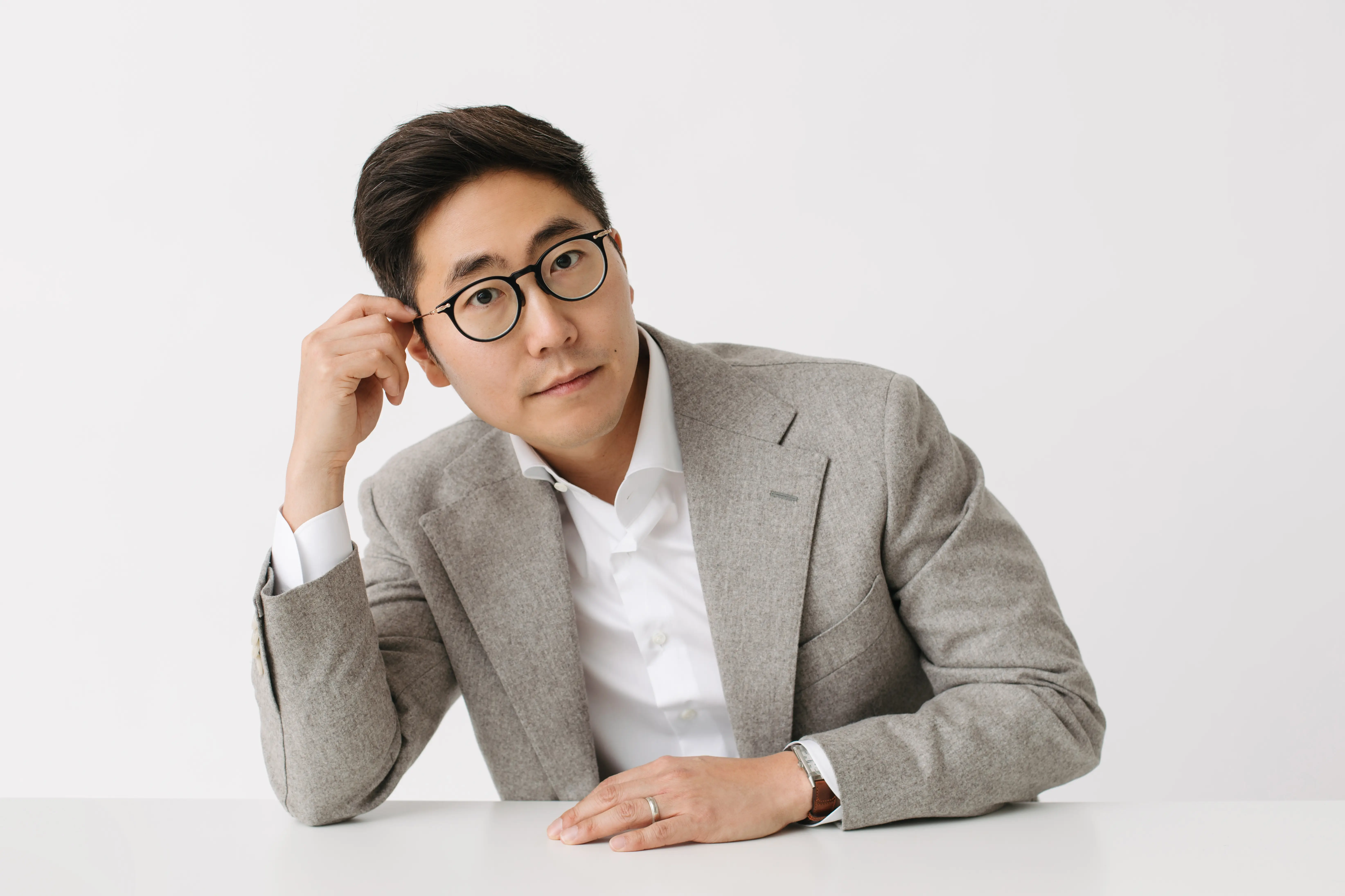 Dr. Chris Kim reviewing patient records at Livewell Dental, Fairfax Station, VA