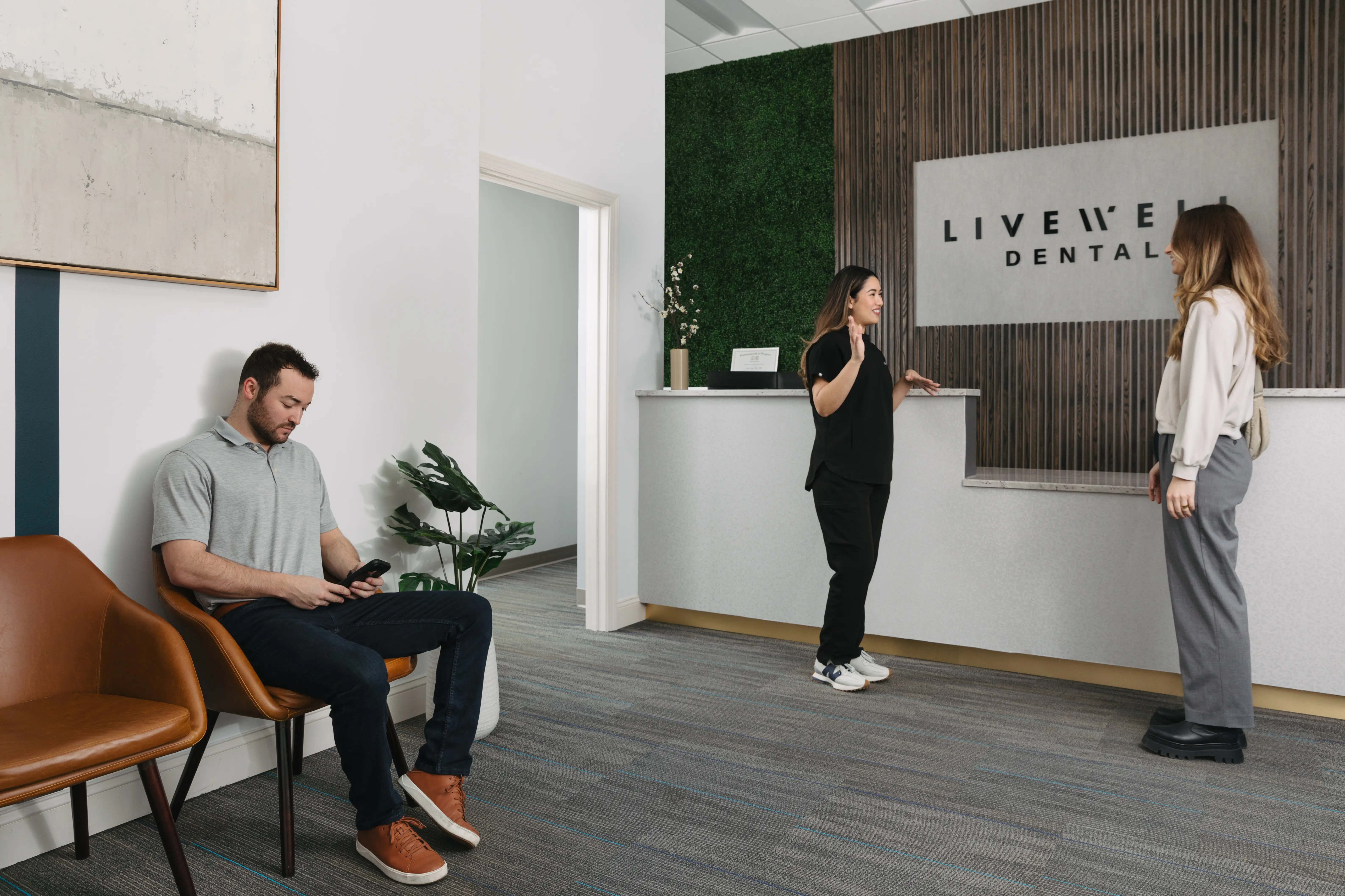 Patient and team member reviewing treatment options at Livewell Dental