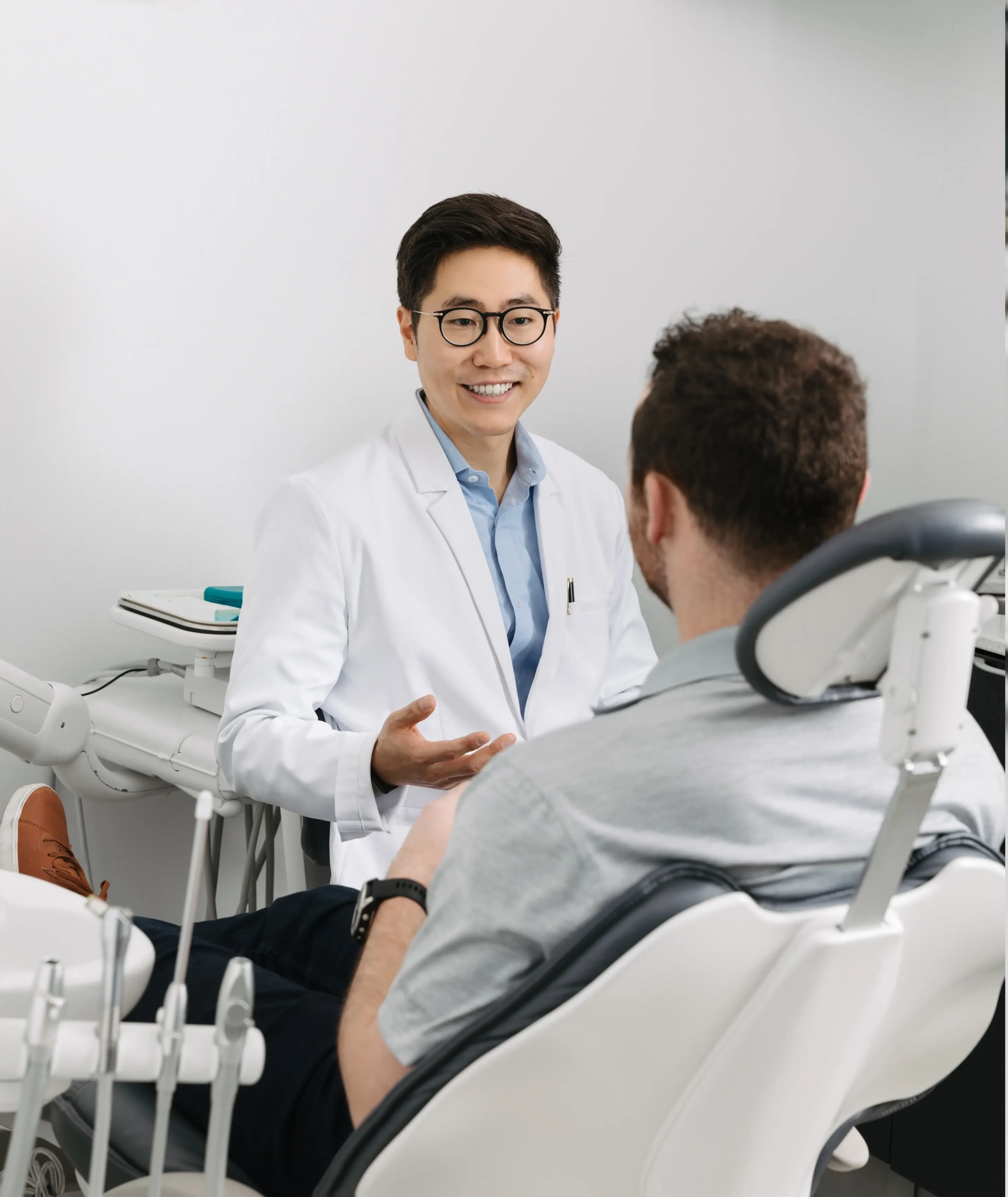 Dr. Chris Kim reviewing a patient case presentation at Livewell Dental