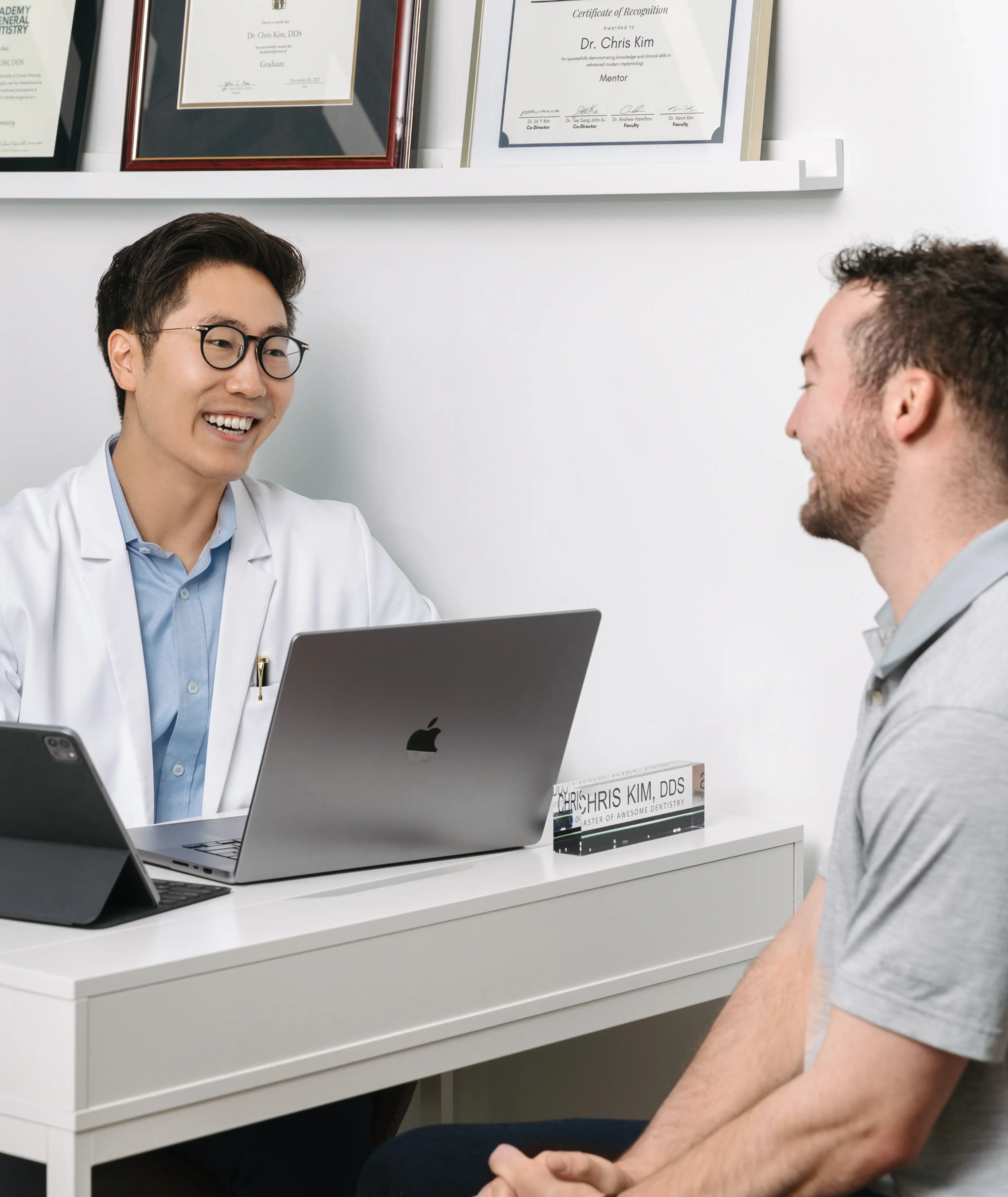 Dr. Chris Kim reviewing a patient case presentation at Livewell Dental