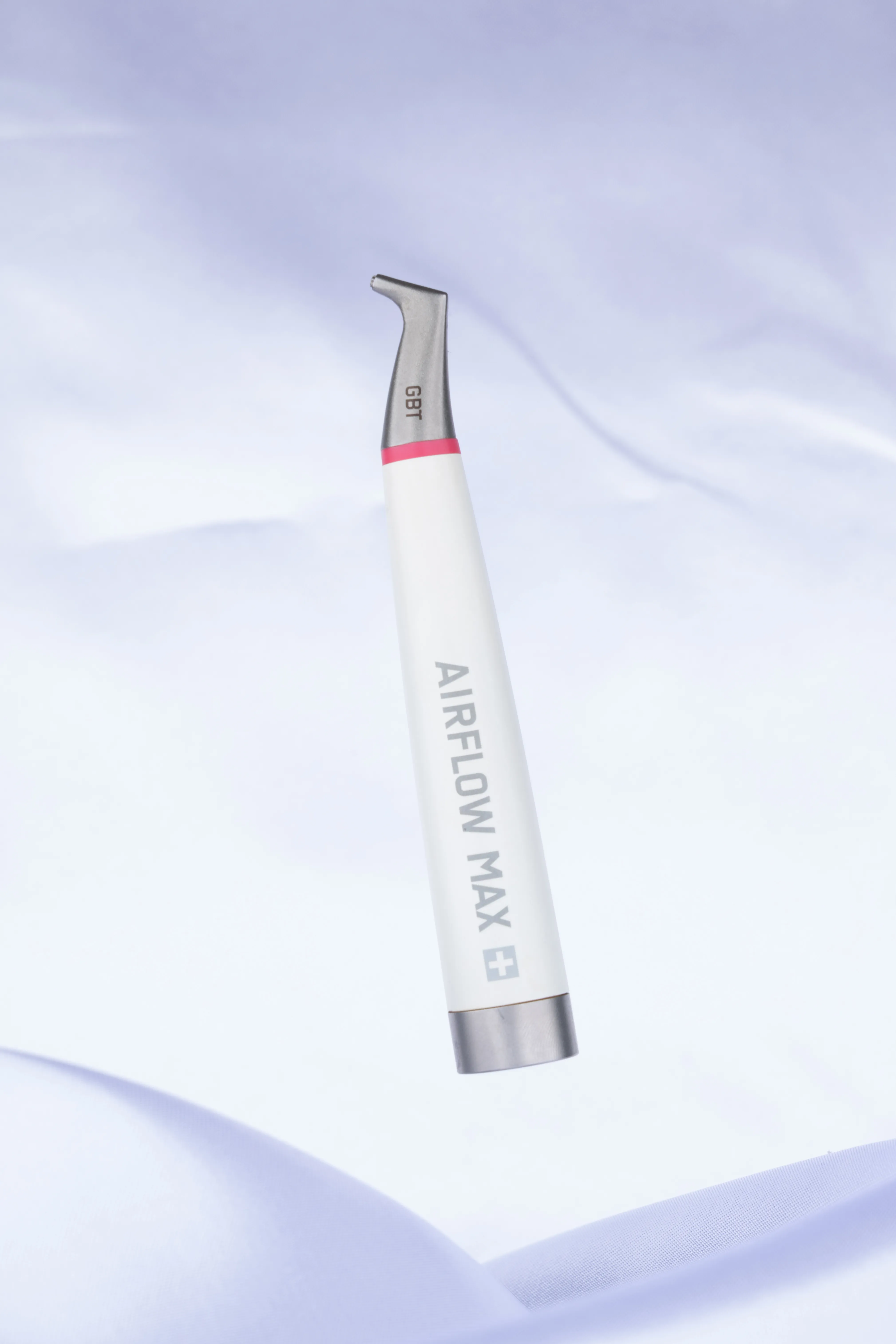 EMS AIRFLOW air-polishing handpiece used for Guided Biofilm Therapy cleanings