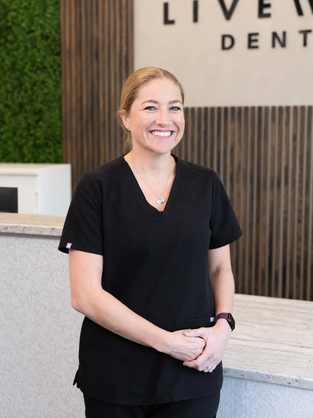 Robyn, dental hygienist at Livewell Dental, smiling in the Fairfax Station VA office