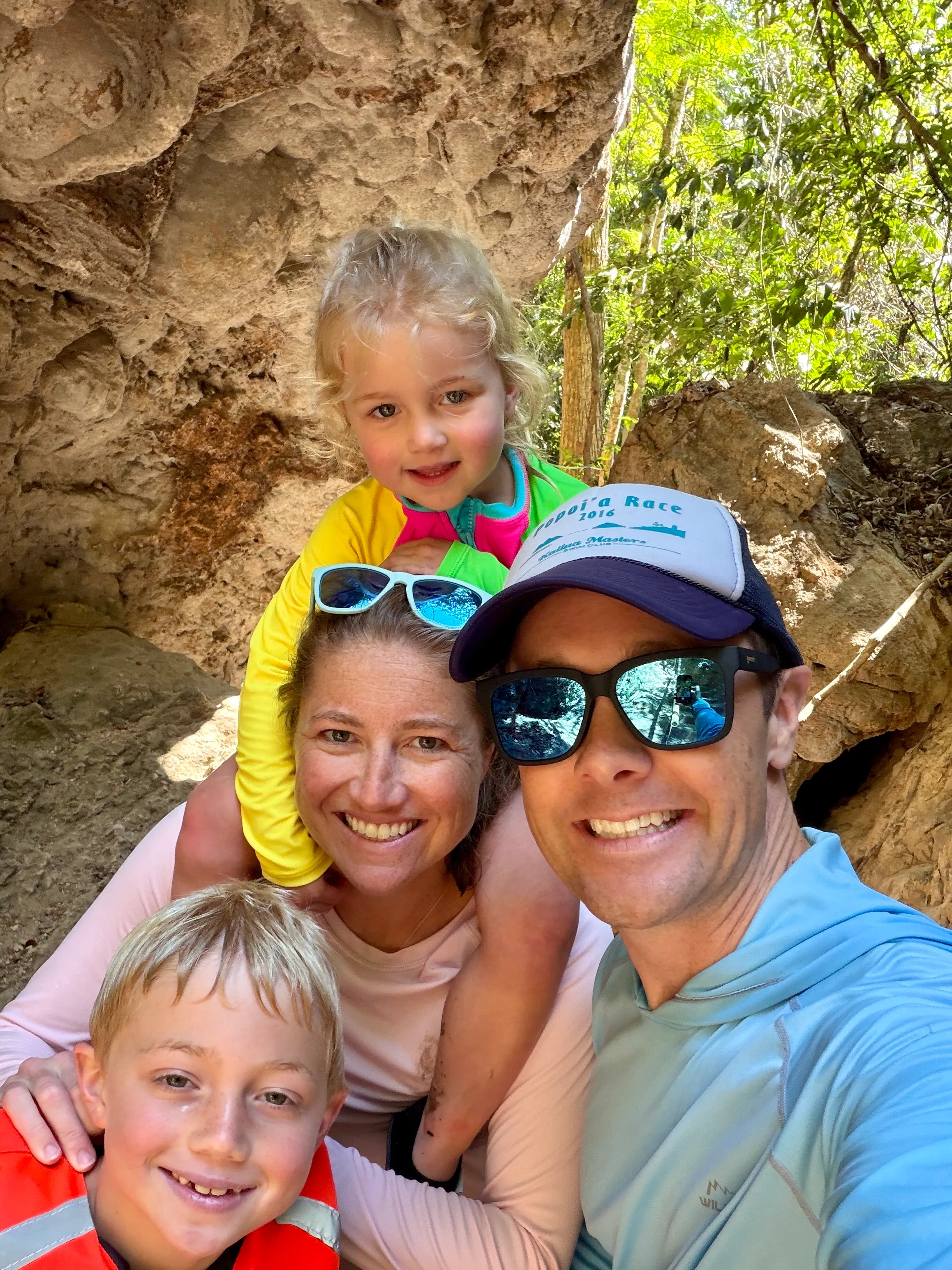 Robyn hiking outdoors with her husband and two young children
