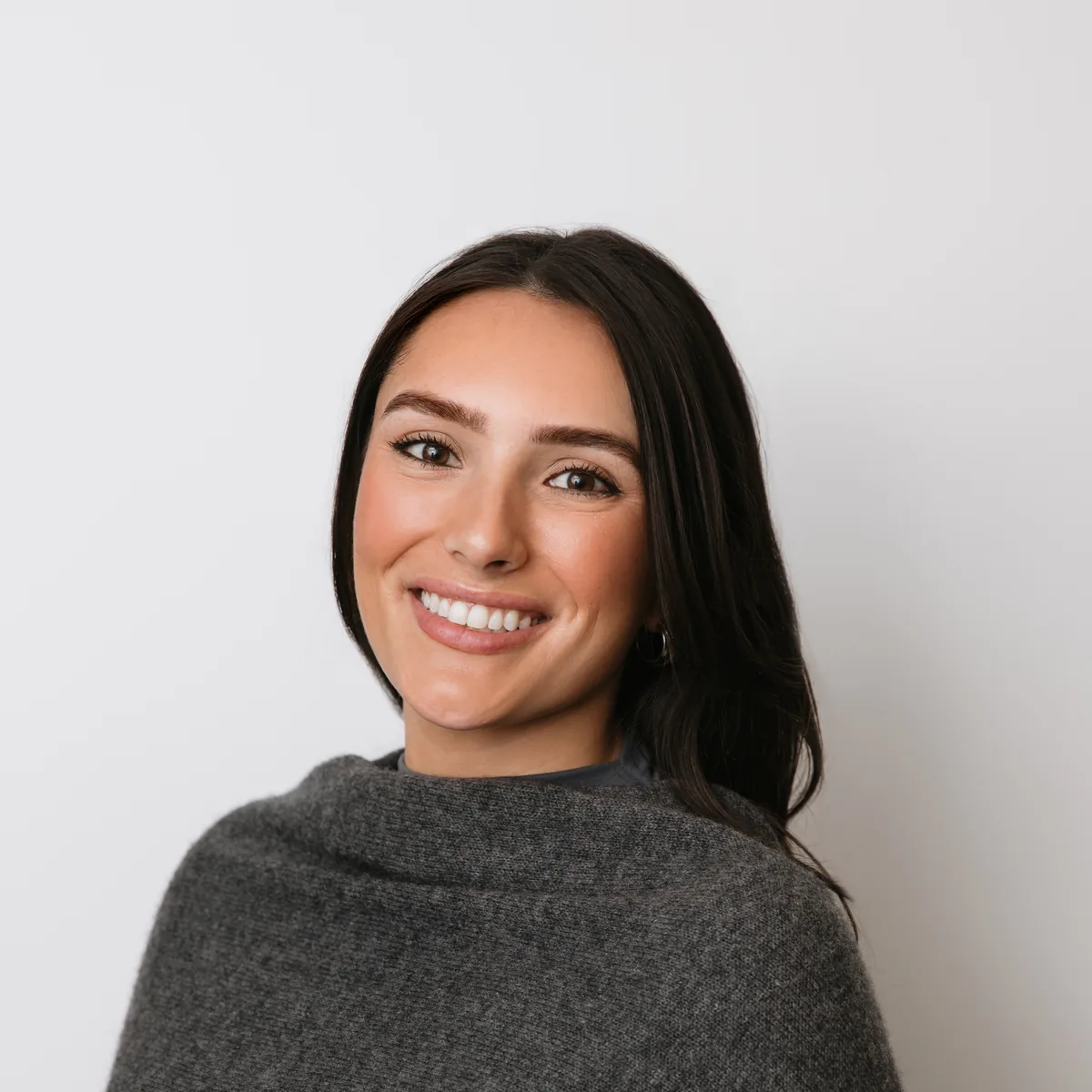 Woman smiling confidently, photographed for Livewell Dental