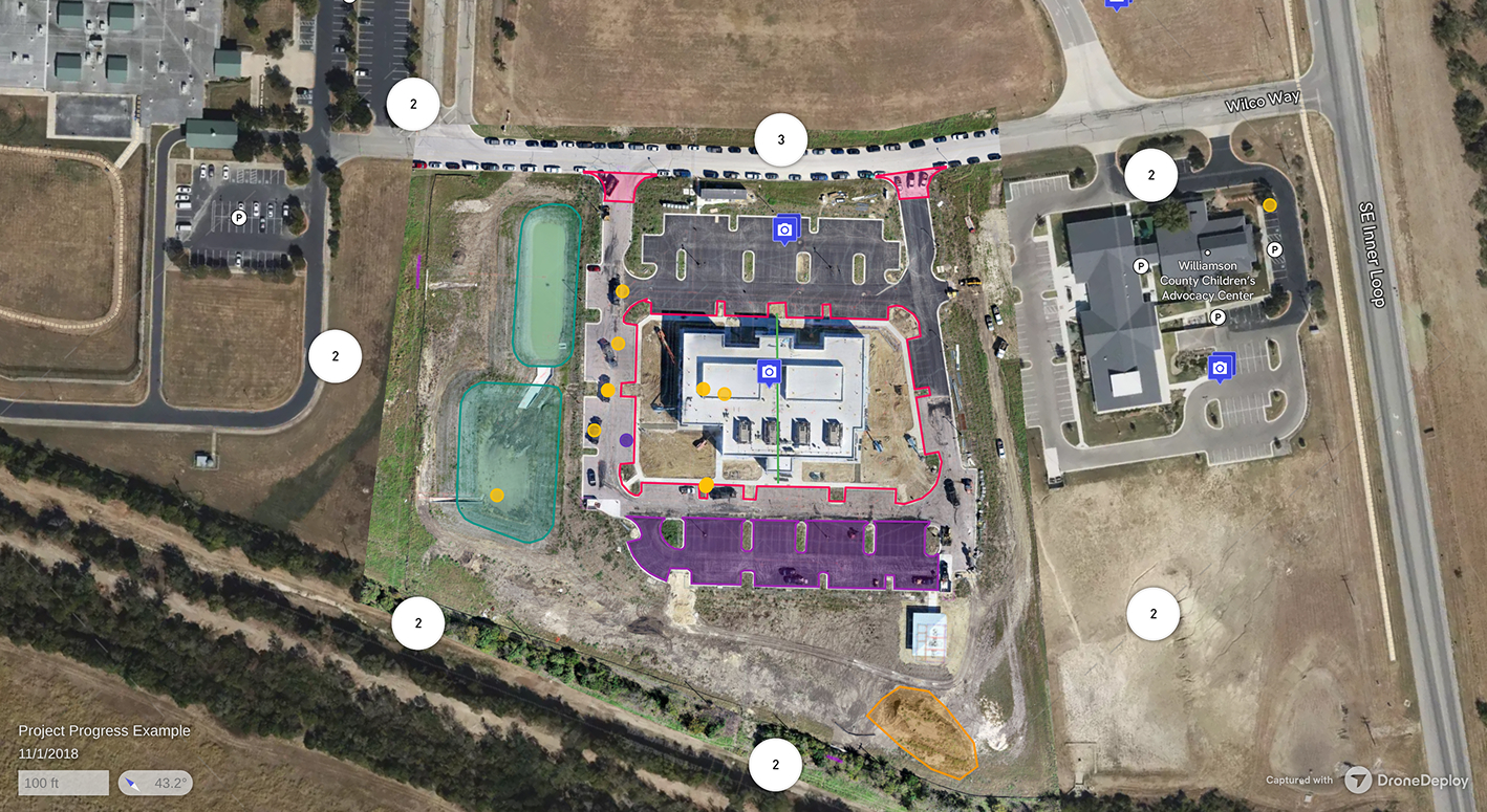 Aerial map showing a construction site with parking lots, surrounding roads, two water retention ponds, and nearby Williamson County Children's Advocacy Center.