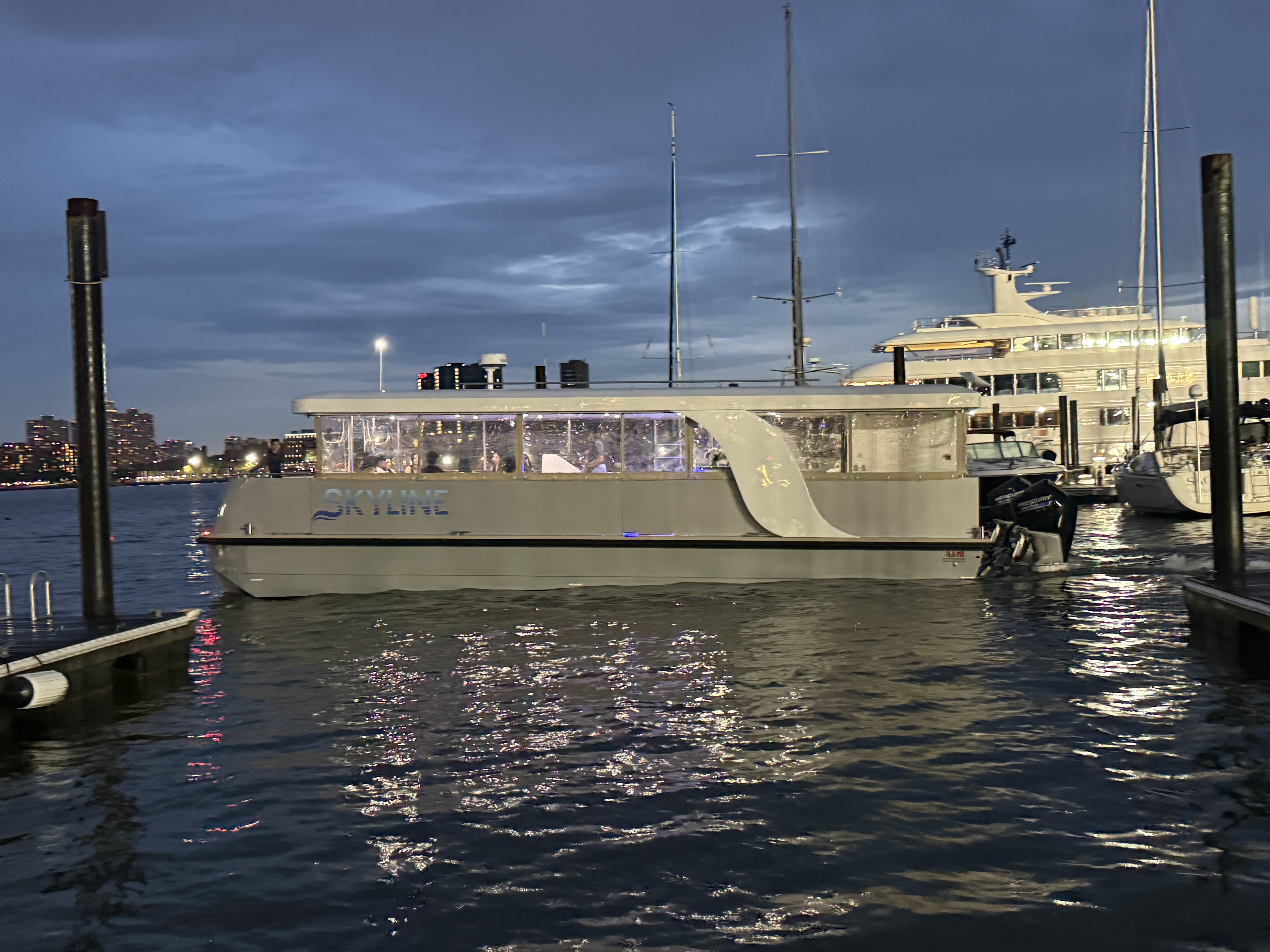 Skyline yacht docked at night in New York Harbor