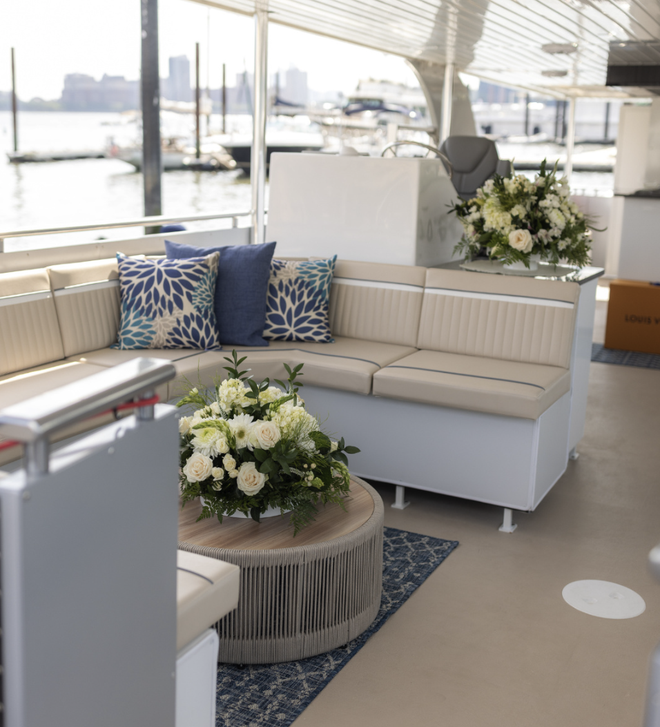 Skyline yacht lounge interior with floral arrangements