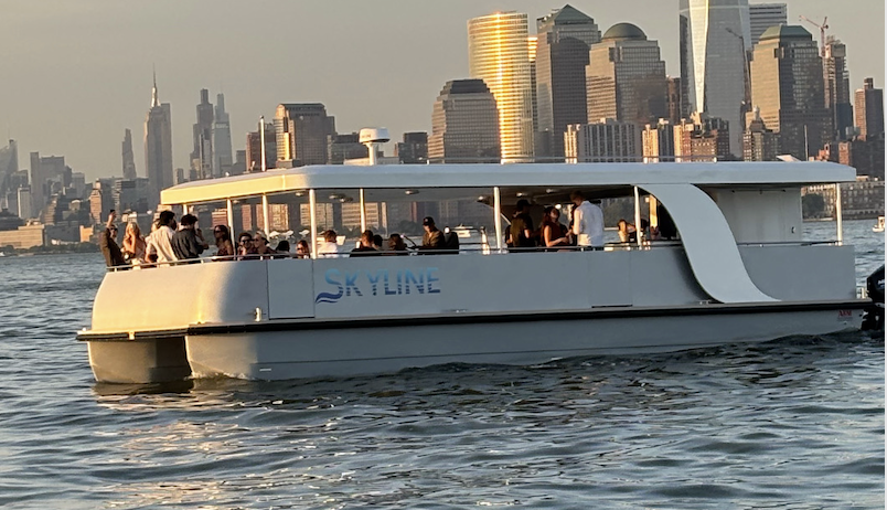 Skyline yacht at sunset with the Manhattan skyline