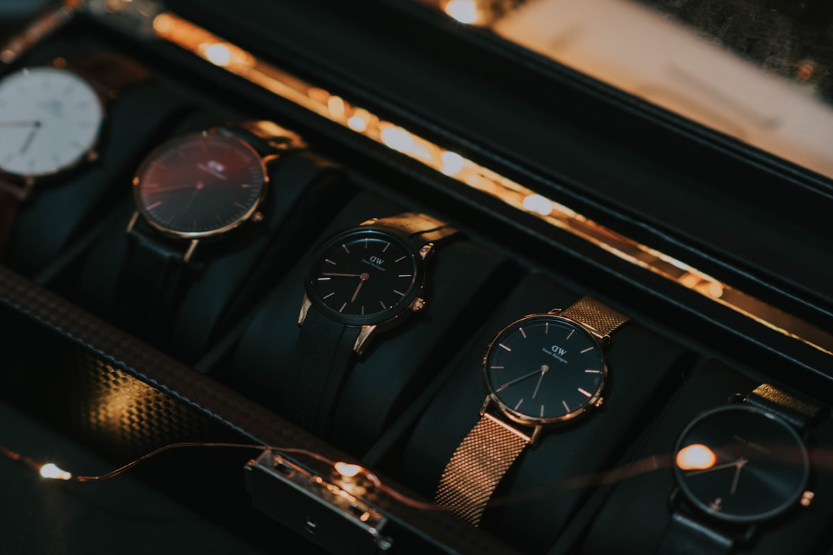 Luxury watches displayed inside an illuminated boutique case