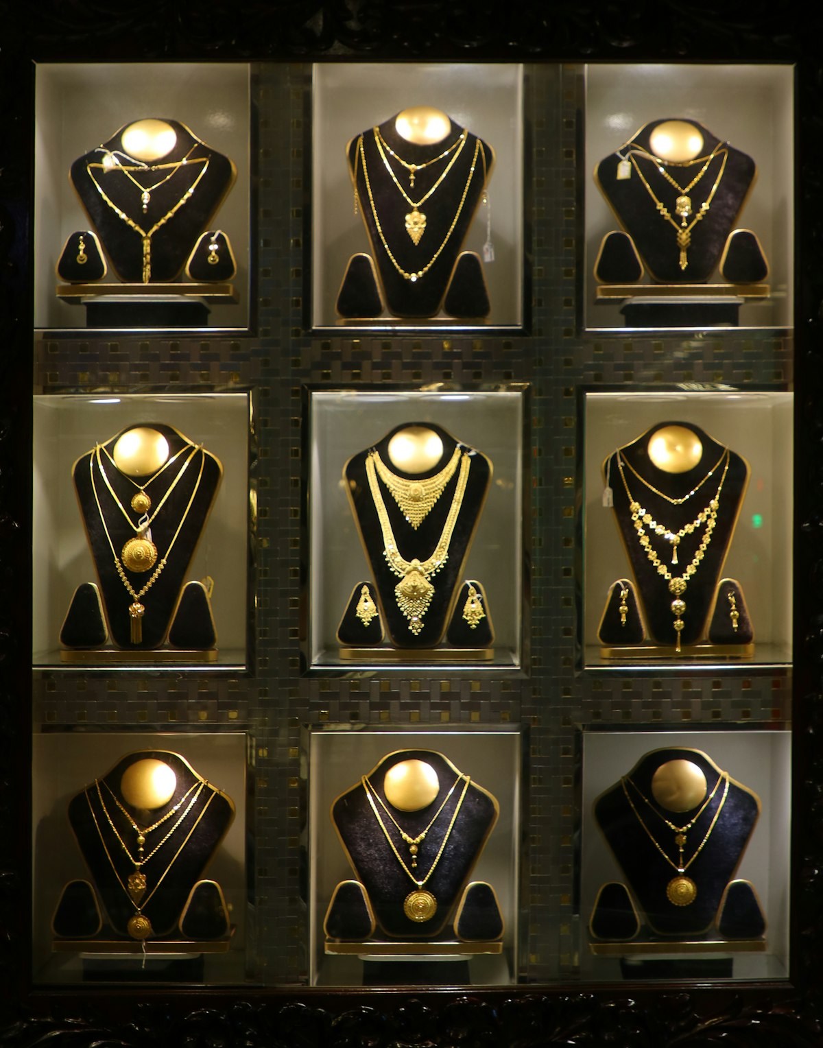 Gold necklaces and fine jewellery displayed in a luxury boutique