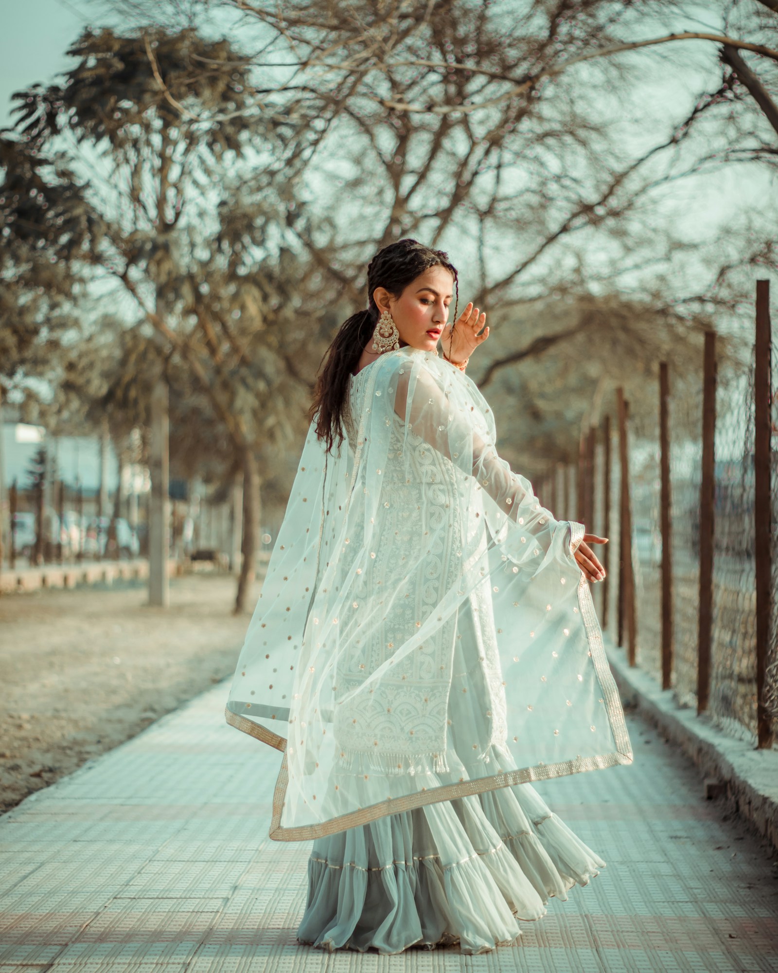 Richly embroidered Indian textile in deep jewel tones — editorial bridal fashion