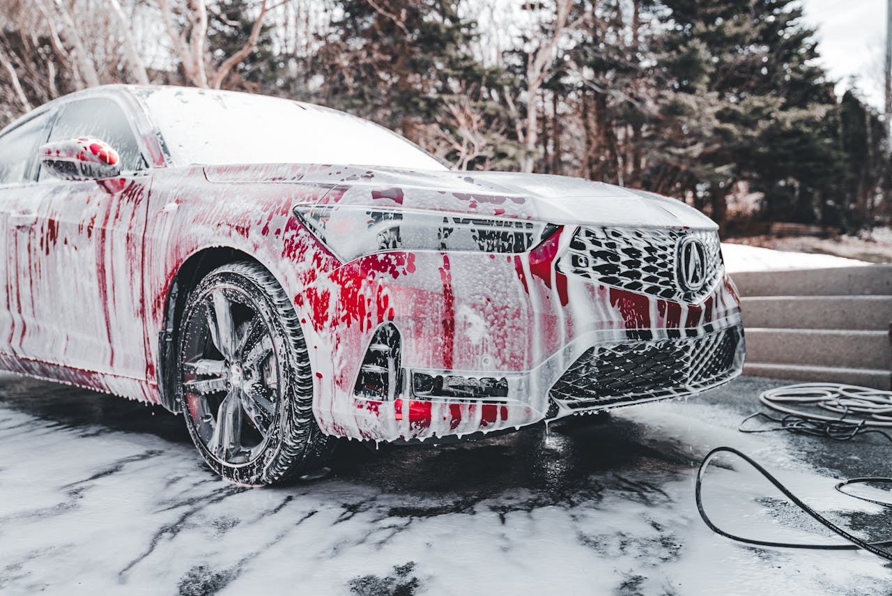 An Acura with high foaming car suds