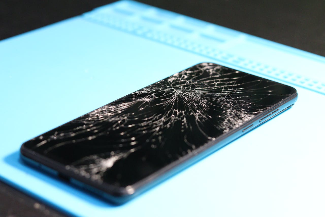 An iPhone with a cracked screen