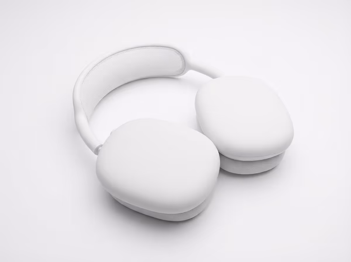 White over-ear wireless headphones with padded ear cushions and headband.