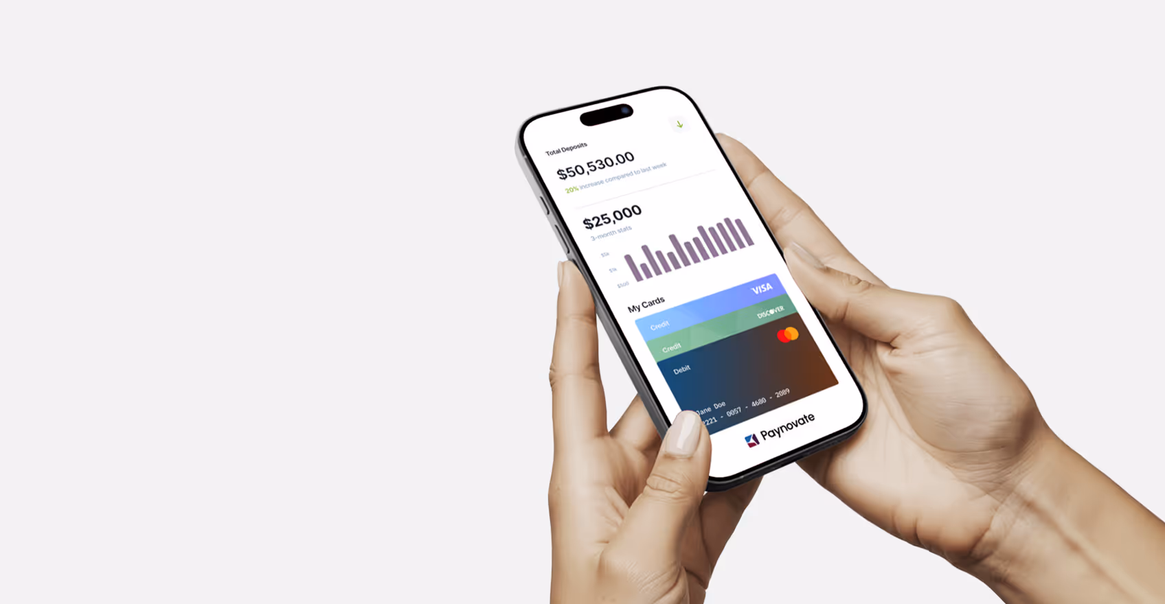 Hands holding a smartphone showing financial app with deposits, stats, and virtual credit cards.