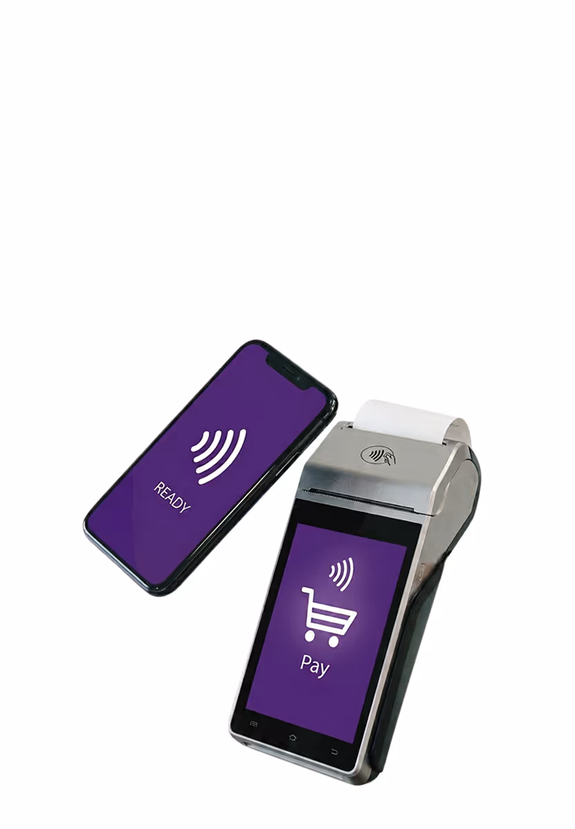Smartphone next to a card payment terminal showing contactless pay icons and shopping cart.