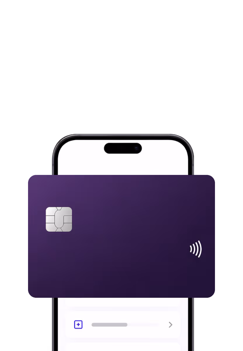Purple contactless credit card partially covering a smartphone with a white screen.