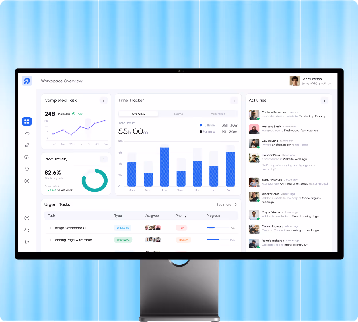 Computer monitor displaying a workspace overview dashboard with completed tasks, productivity efficiency, time tracker, urgent tasks list, and recent activities with user avatars.